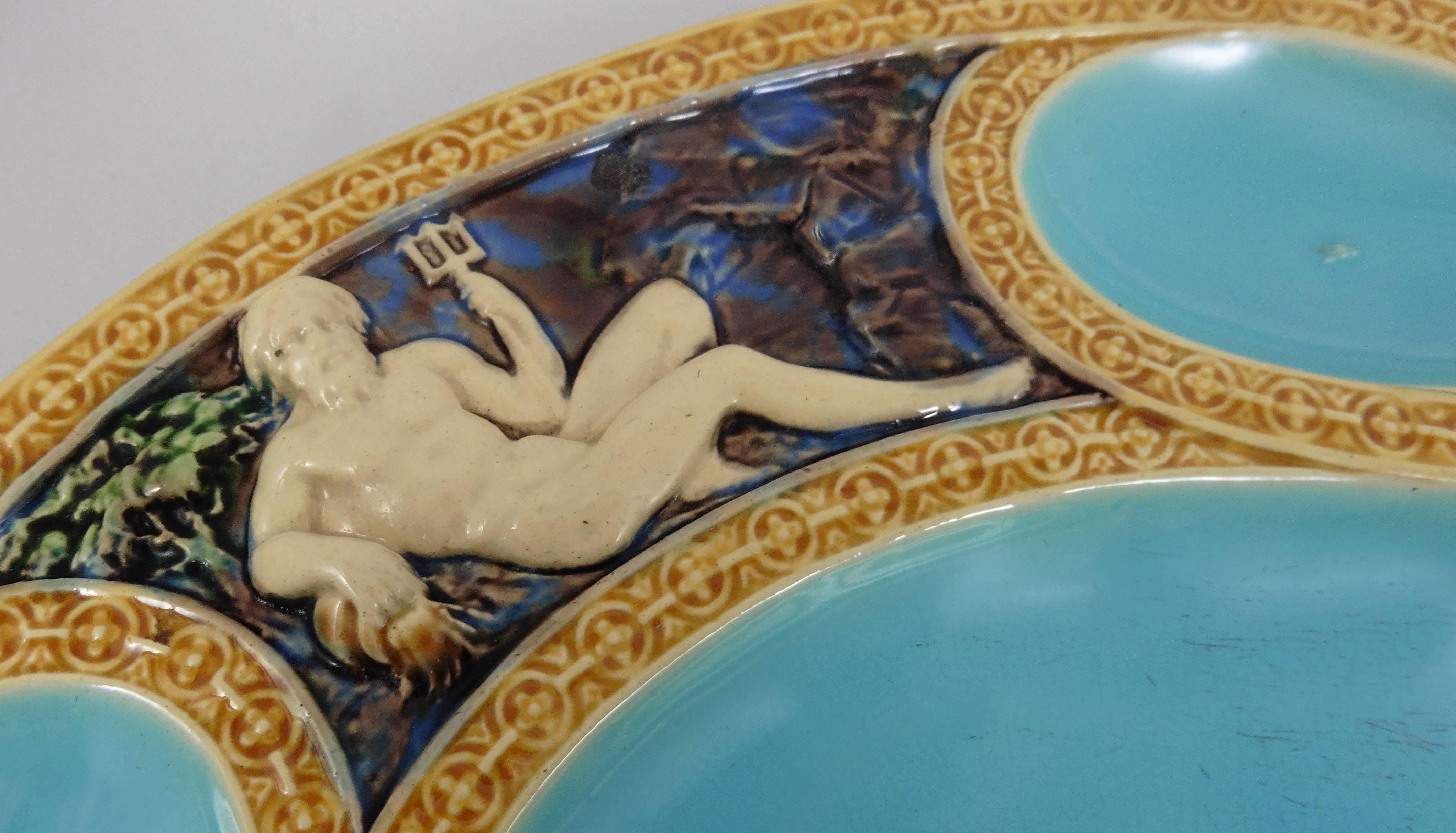 Majolica mythological platter which features four figural panels molded with Juno, Neptune, Mercury and Selene signed Minton, circa 1865.
This platter had a rare turquoise blue background is an example of the Renaissance Revival at the end of the