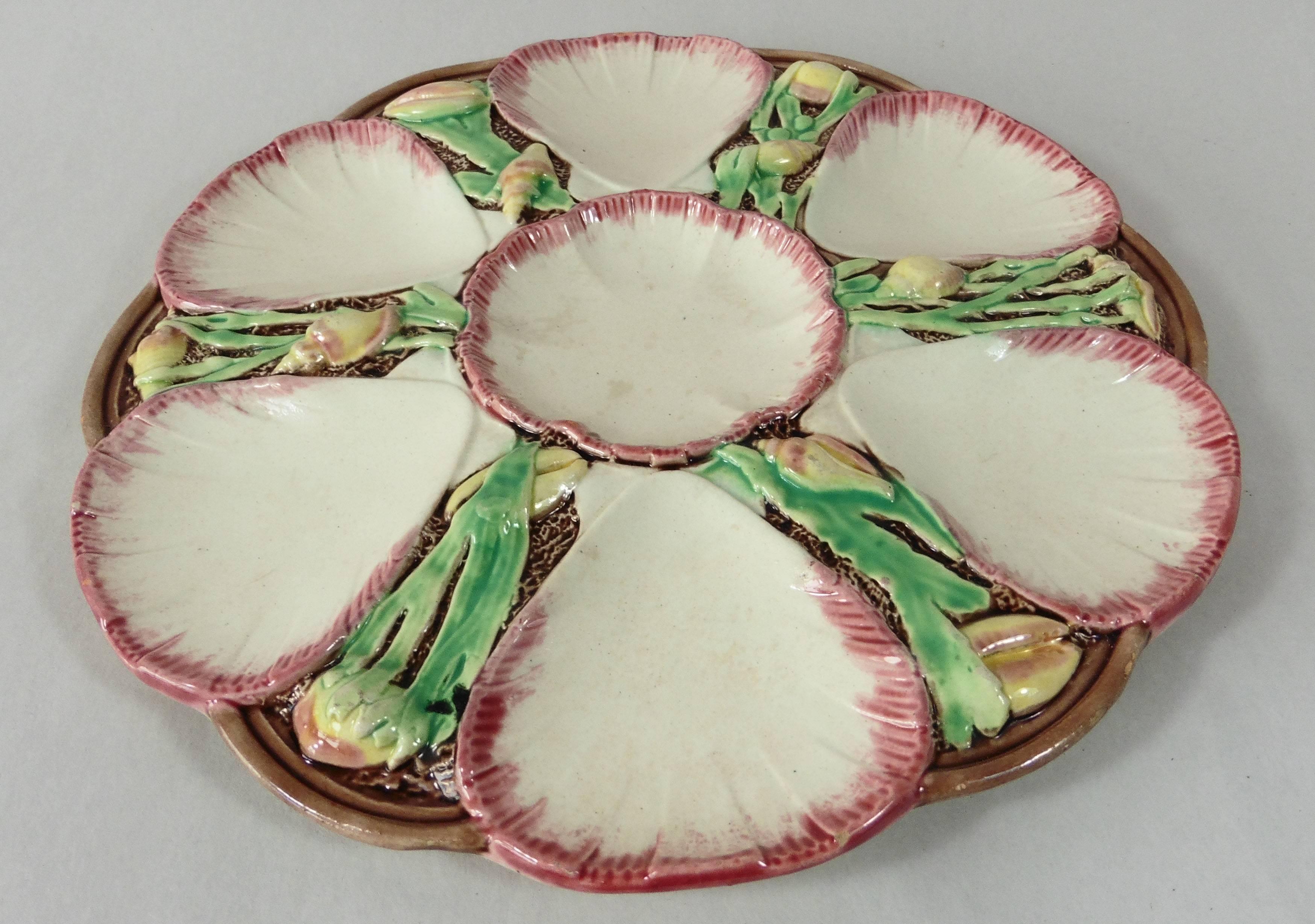 19th Majolica oyster plate with shells and seaweeds attributed to Victoria Pottery Company.
The Majolica of the Victorian Pottery Company is rarely seen because it was a brief production (1882-1889) it's also rarely signed. The production is among