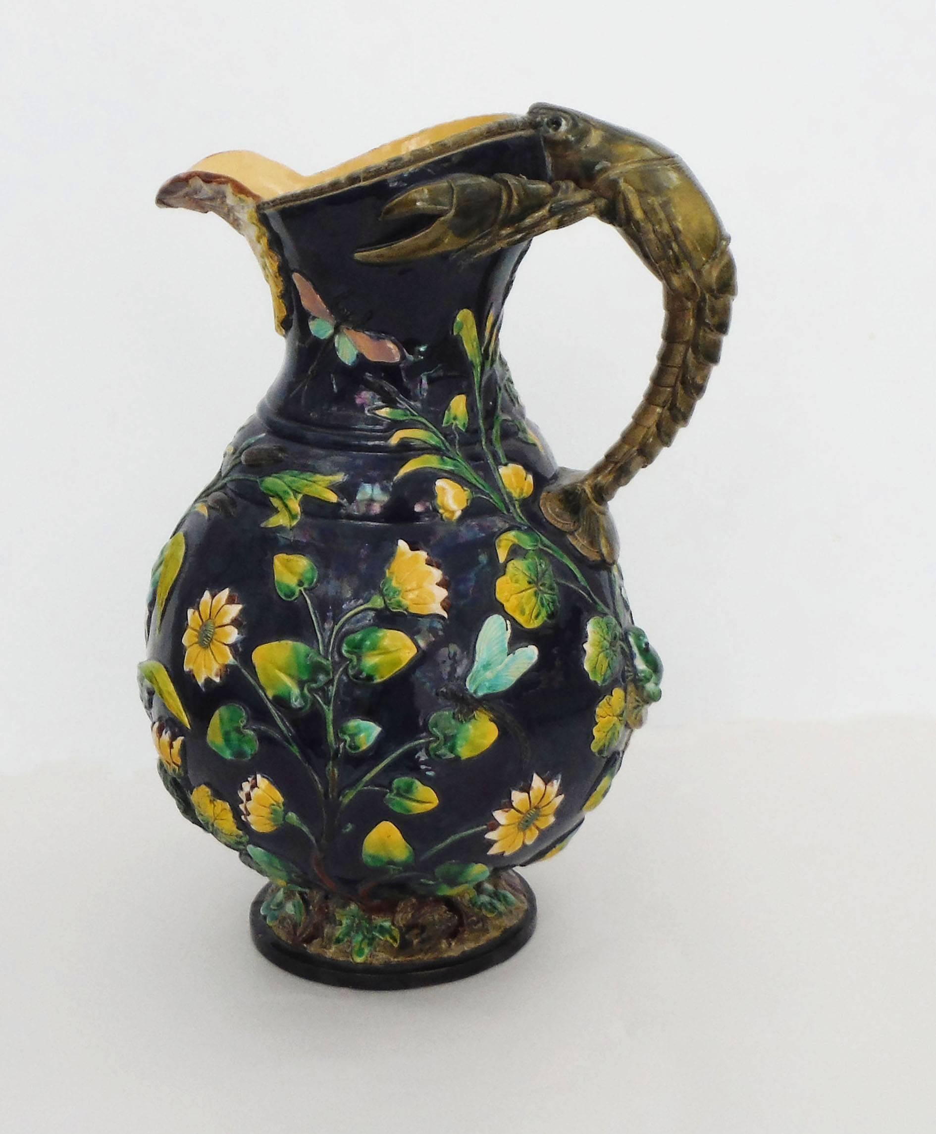 Monumental 19th Century Majolica ewer with crawfish handle, dragonfly snail, grasshopper, frog and aquatics plants, signed Wilhelm Schiller & Son.
A Fine quality for this large ewer and an extraordinary example of the naturalism of the 19th