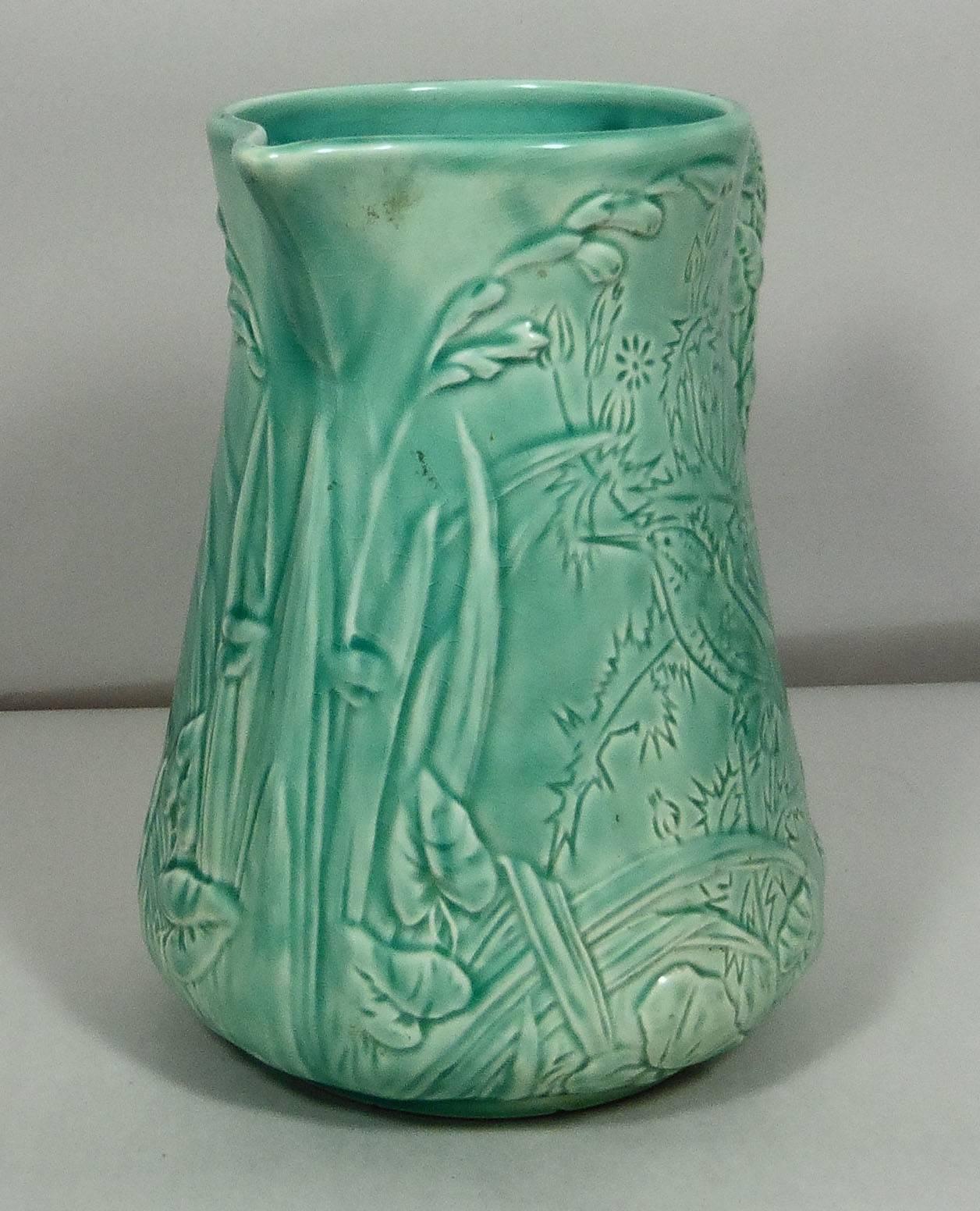 19th French Majolica aqua turquoise pitcher with birds, herbs, leaves and plants.