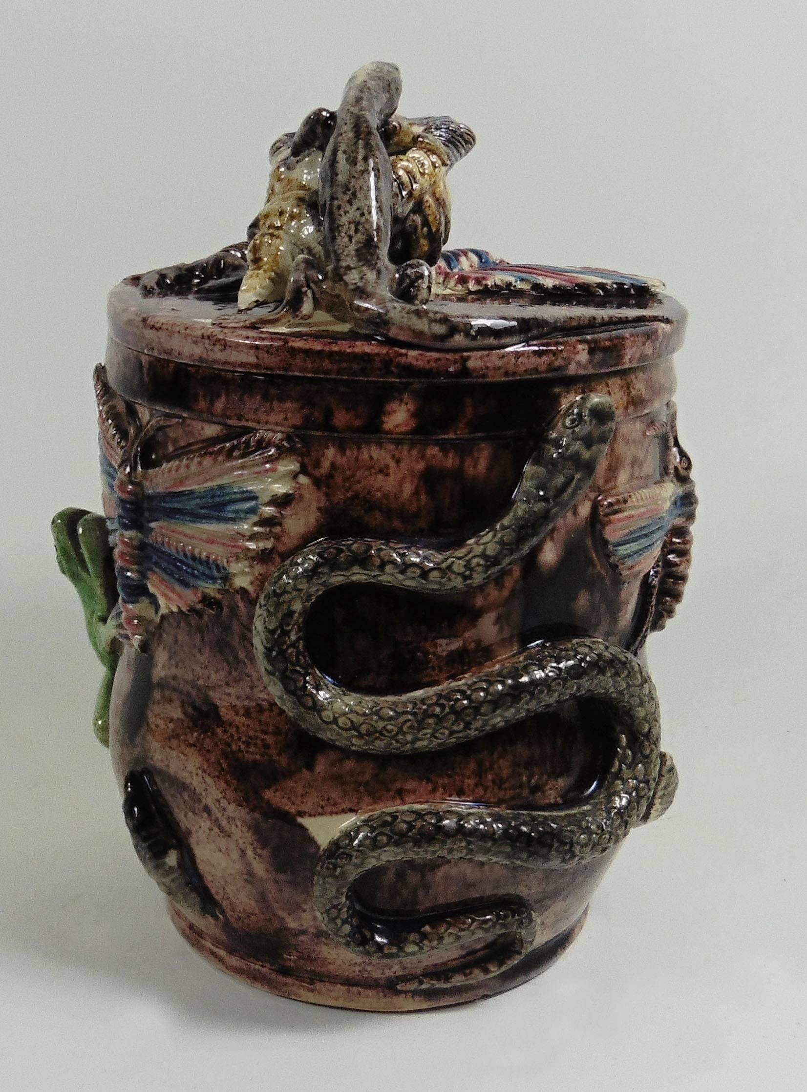 Large Portuguese Palissy tobacco jar attributed to Manuel Mafra.
This tobacco jar is decorated in high relief of a frog, large butterflies, bugs, shells, a snake, a crocodile, on the lid a large shell with a lizard on the top, a butterfly and a