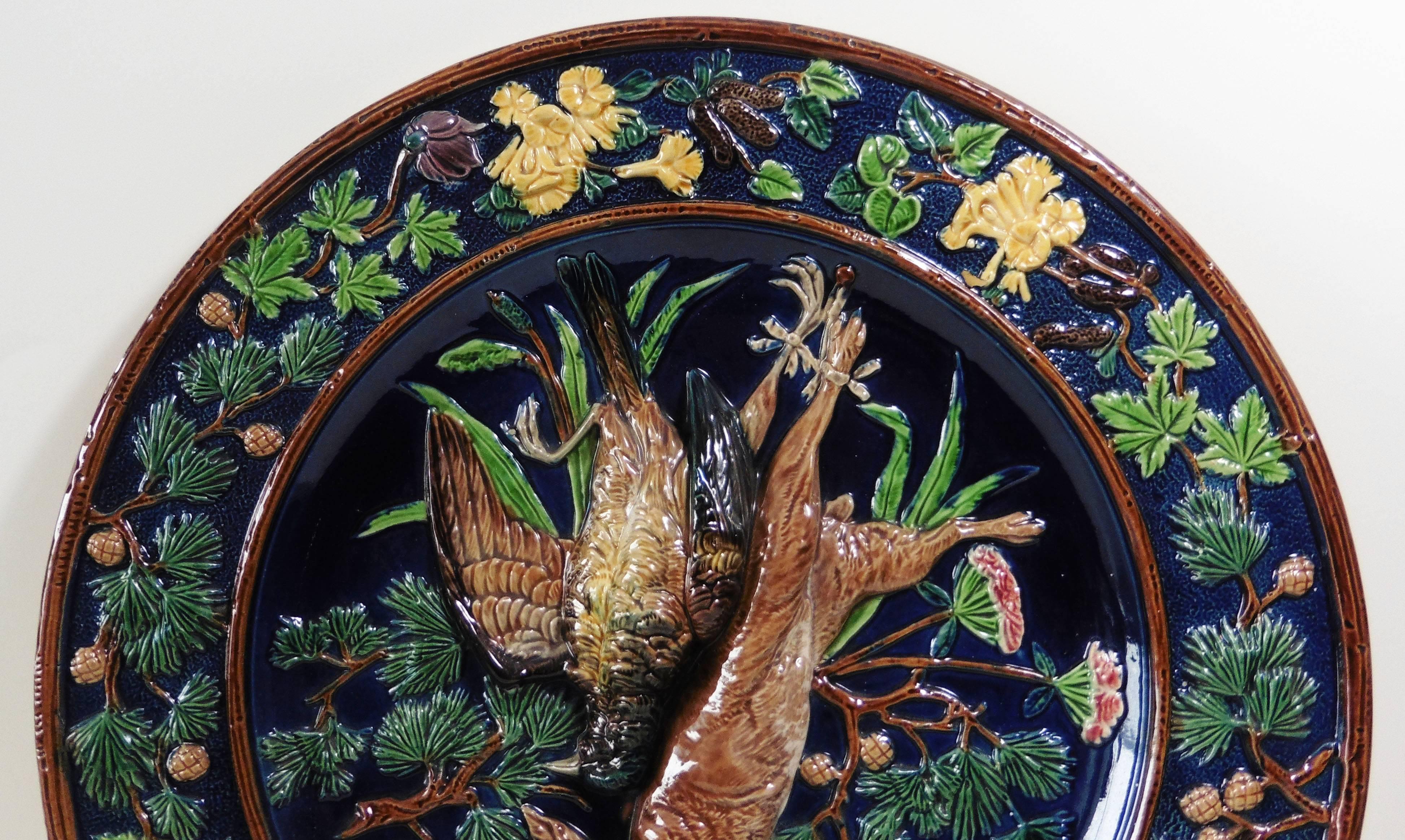 Large 19th Majolica trophies wall platter or charger signed Johann Maresch.
On a dark blue cobalt background, a large trophy with bird and hare with needles and cones pine, the border is decorated with yellow, purple and pink flowers.
Measures: