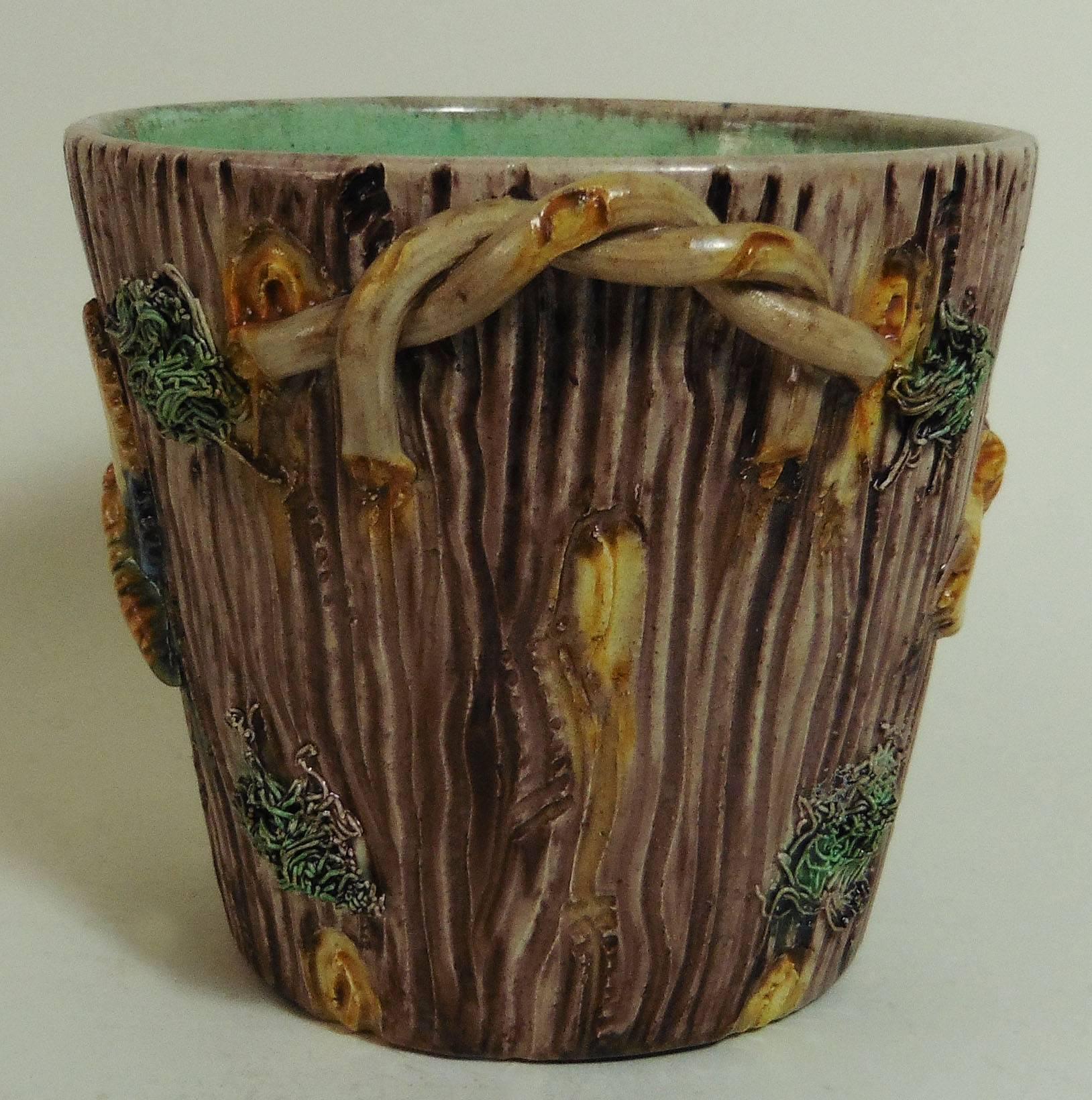 Palissy Trompe l 'oeil wood trunk cache pot decorated with large butterflies, the handles are interlaced twigs signed Thomas Sergent, circa 1880.
Thomas Victor Sergent was an active member of the School of Paris with others ceramists he made