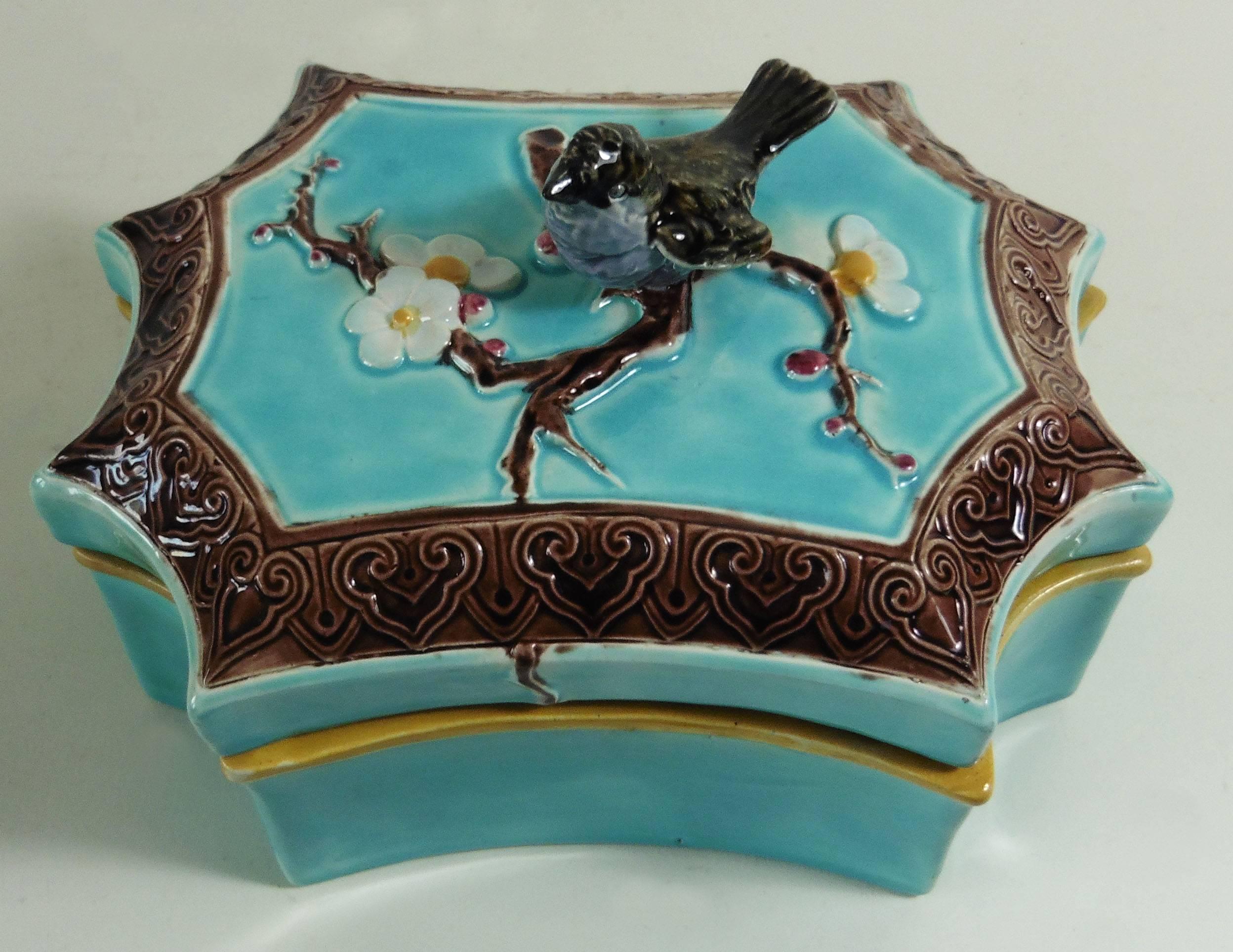 19th century Victorian Majolica turquoise box with a bird handle and white flowers attributed to Joseph Holdcroft.
Very rare shape box.
                   