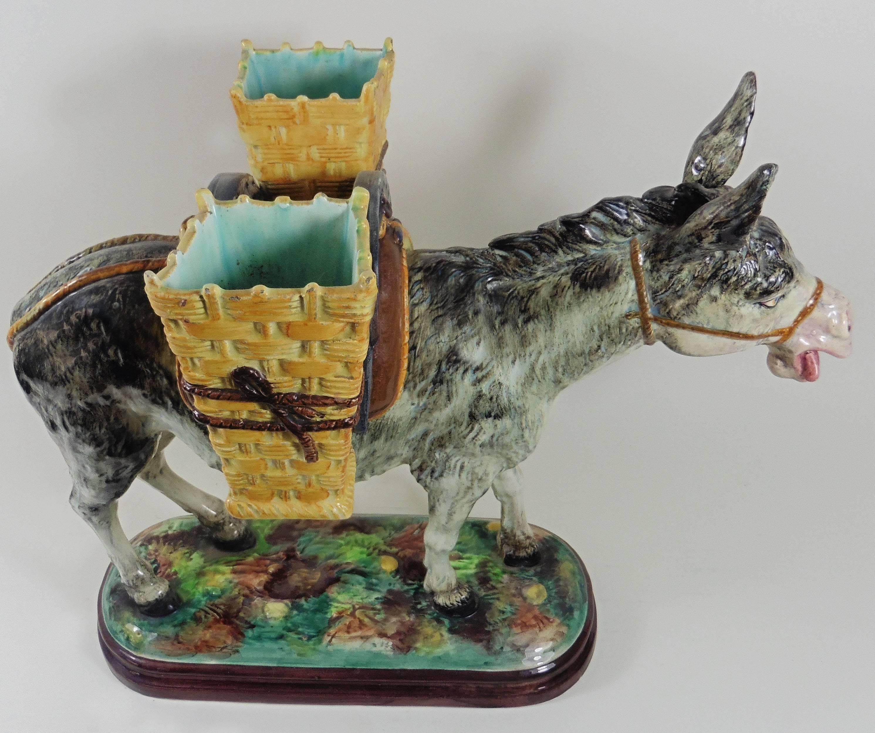 Fine large Majolica donkey with his two yellow baskets signed Jerome Massier Fils, circa 1900.
The Massier are known for the quality of their unique enamels and paintings. The Massier family excelled in the representation of all animals at the end