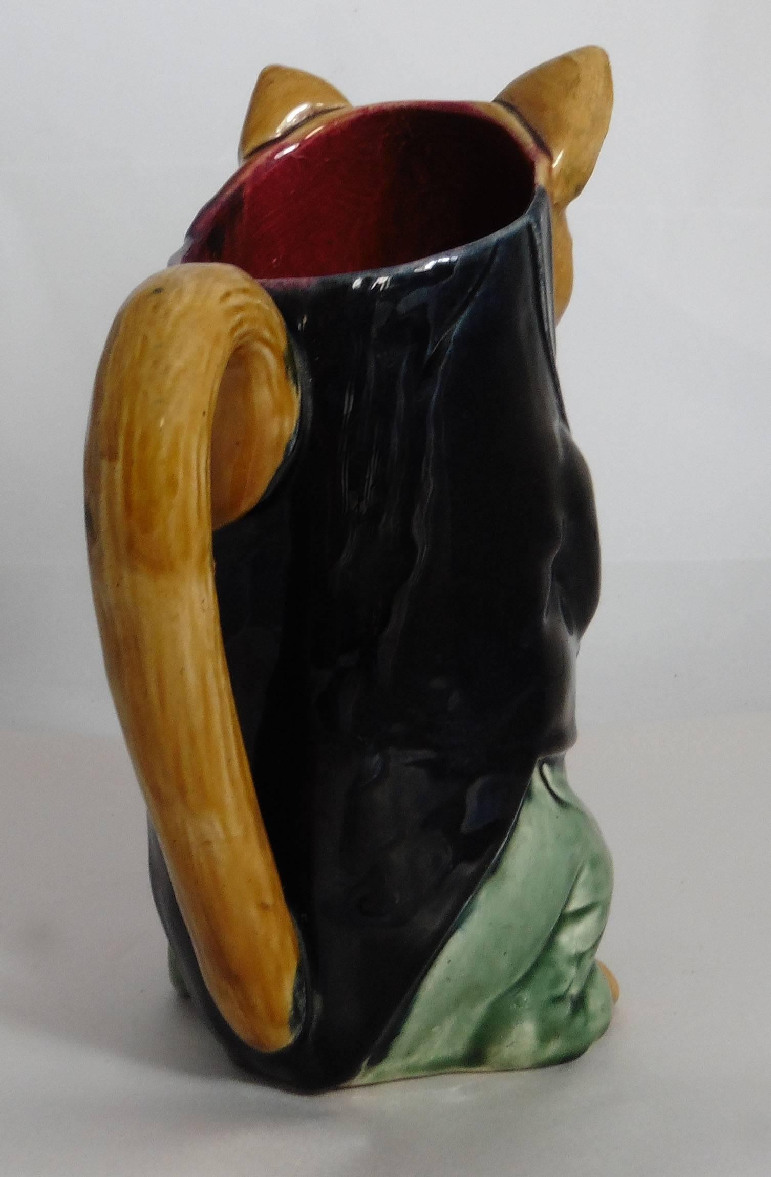 French Majolica cat pitcher with mandolin signed Orchies Z3, circa 1900.
This pitcher exist in different colors, three different examples are available.