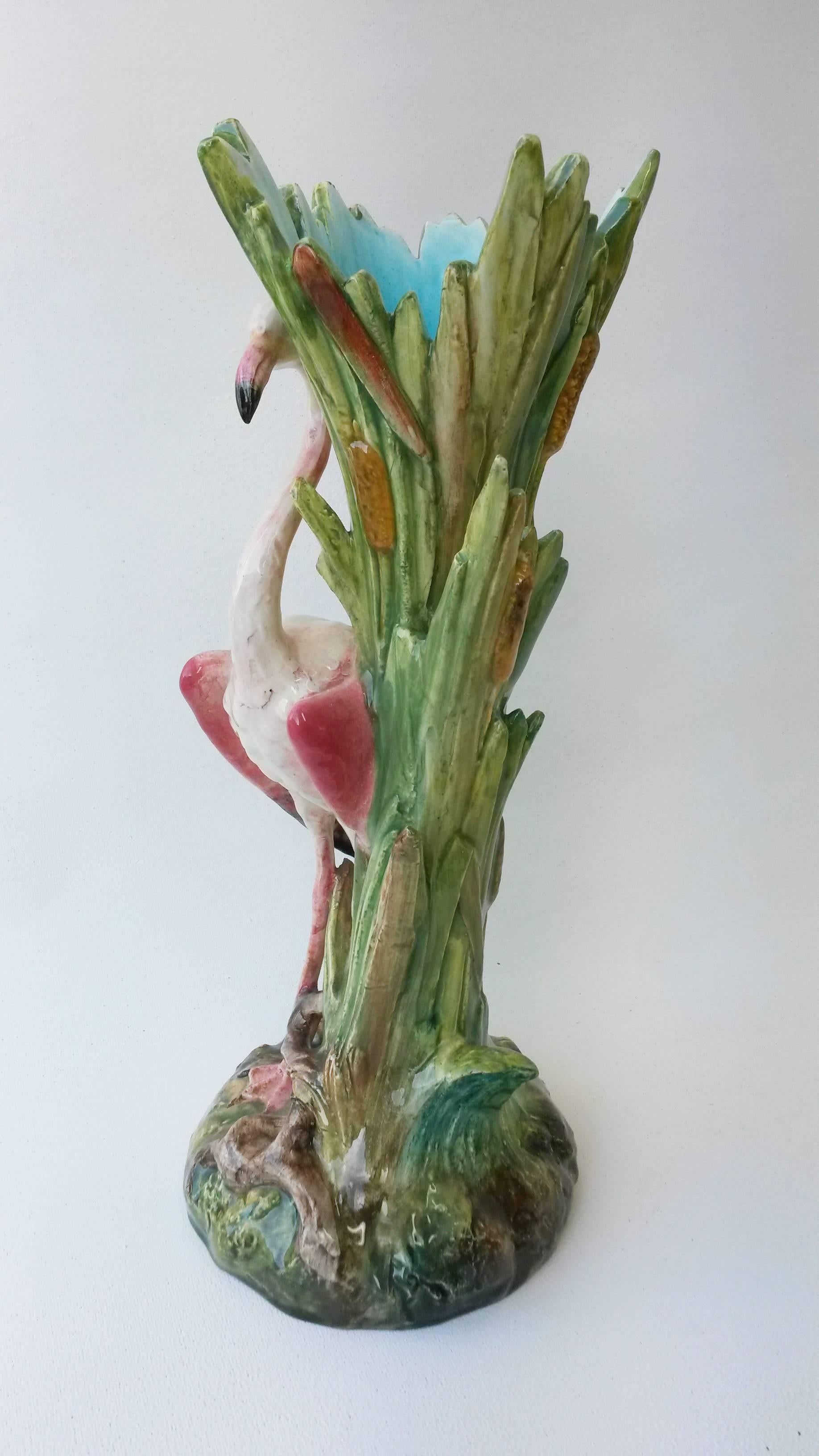 Elegant Majolica vase with a flamingo in front of leaves vase signed Delphin Massier, circa 1890.
The Massier are known for the quality of their unique enamels and paintings. The Massier family excelled in the representation of all animals at the