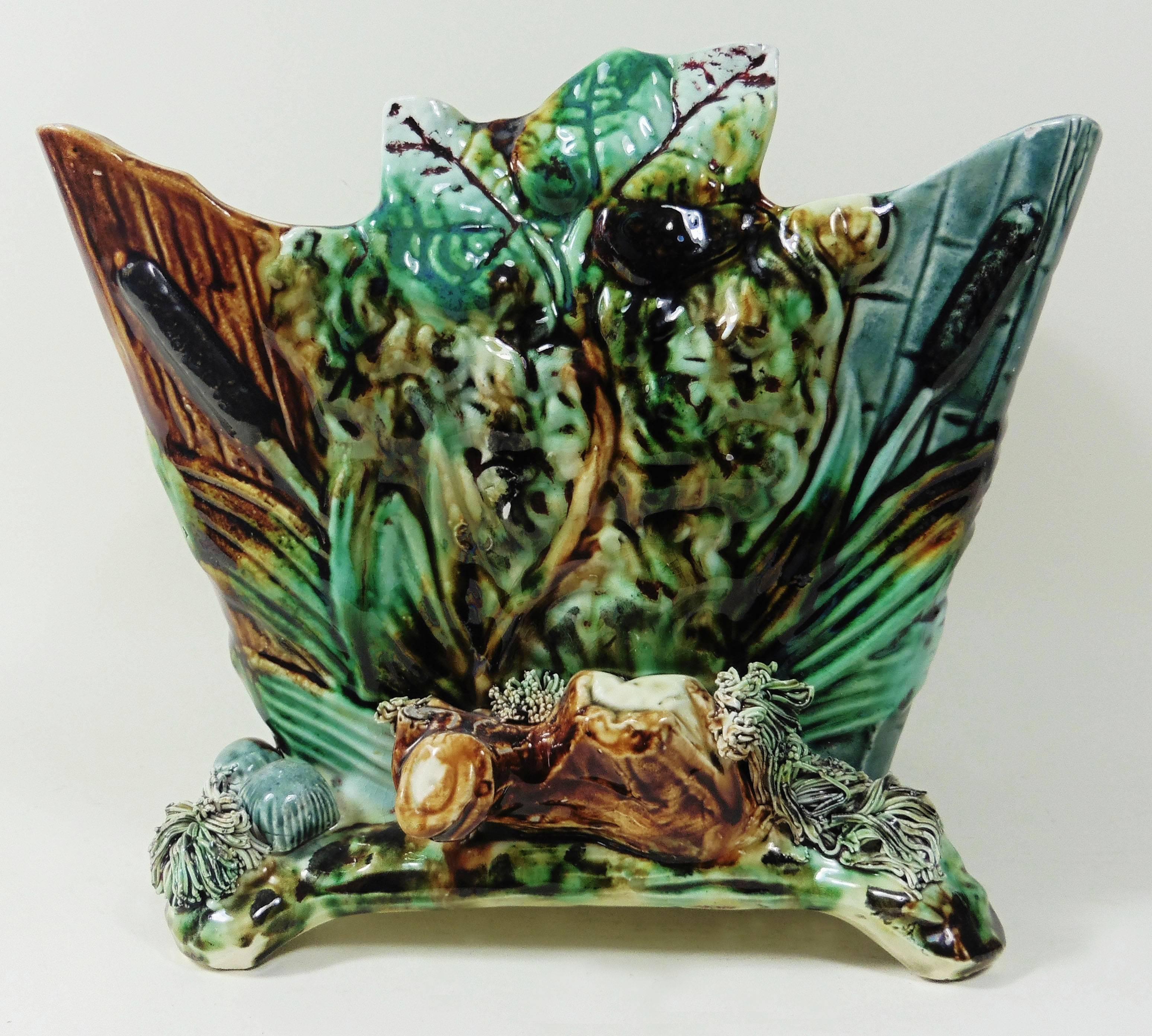 French 19th Majolica jardiniere in a shape of wood box decorated with leaves, on the front a bird with his nest, a snake looking on the nest with eggs.
Palissy style, circa 1890.
Minors hairlines.