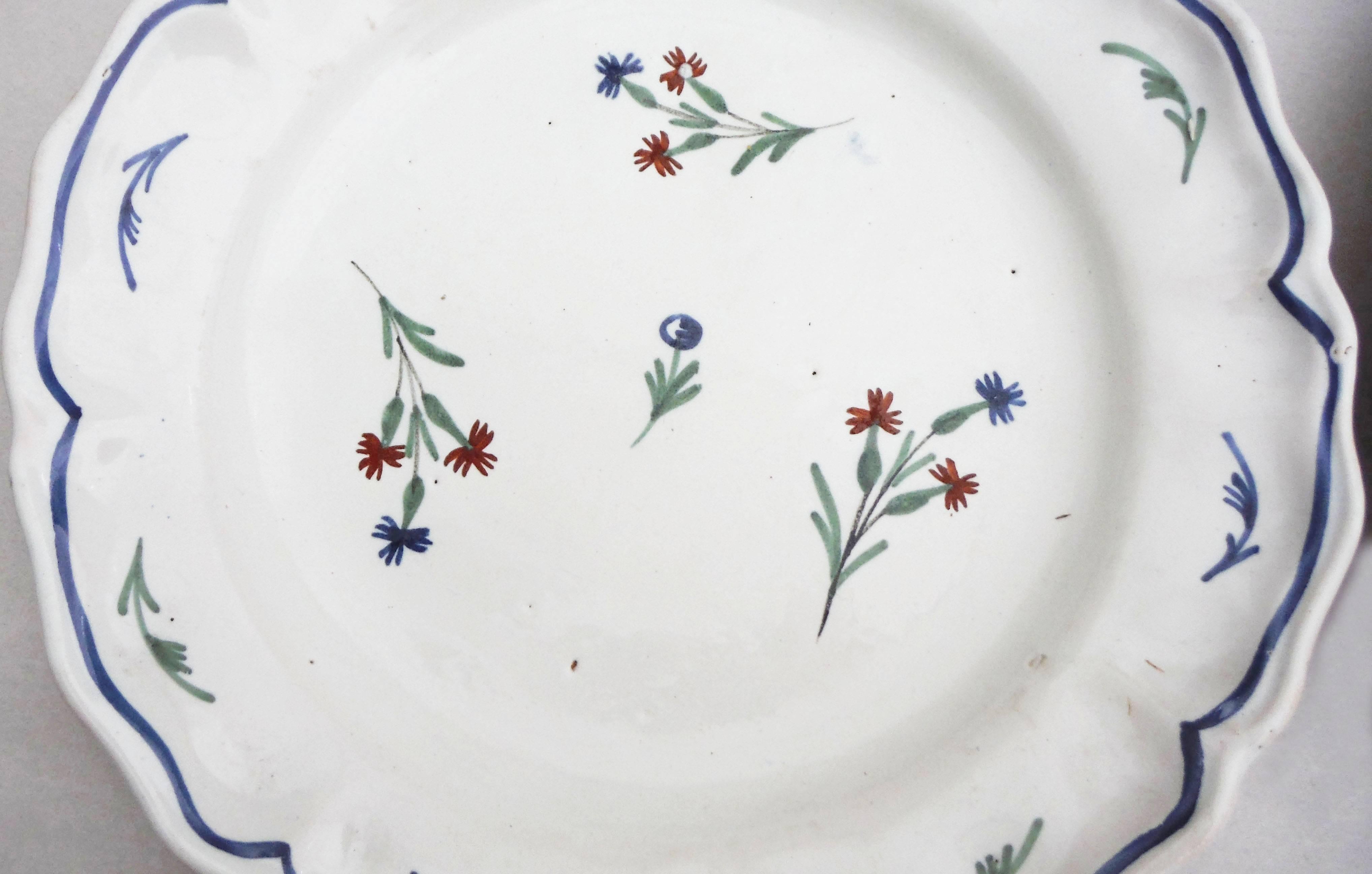 Pair of 19th century French faience plates with wild flowers, a very delicate decoration in a great conditions.