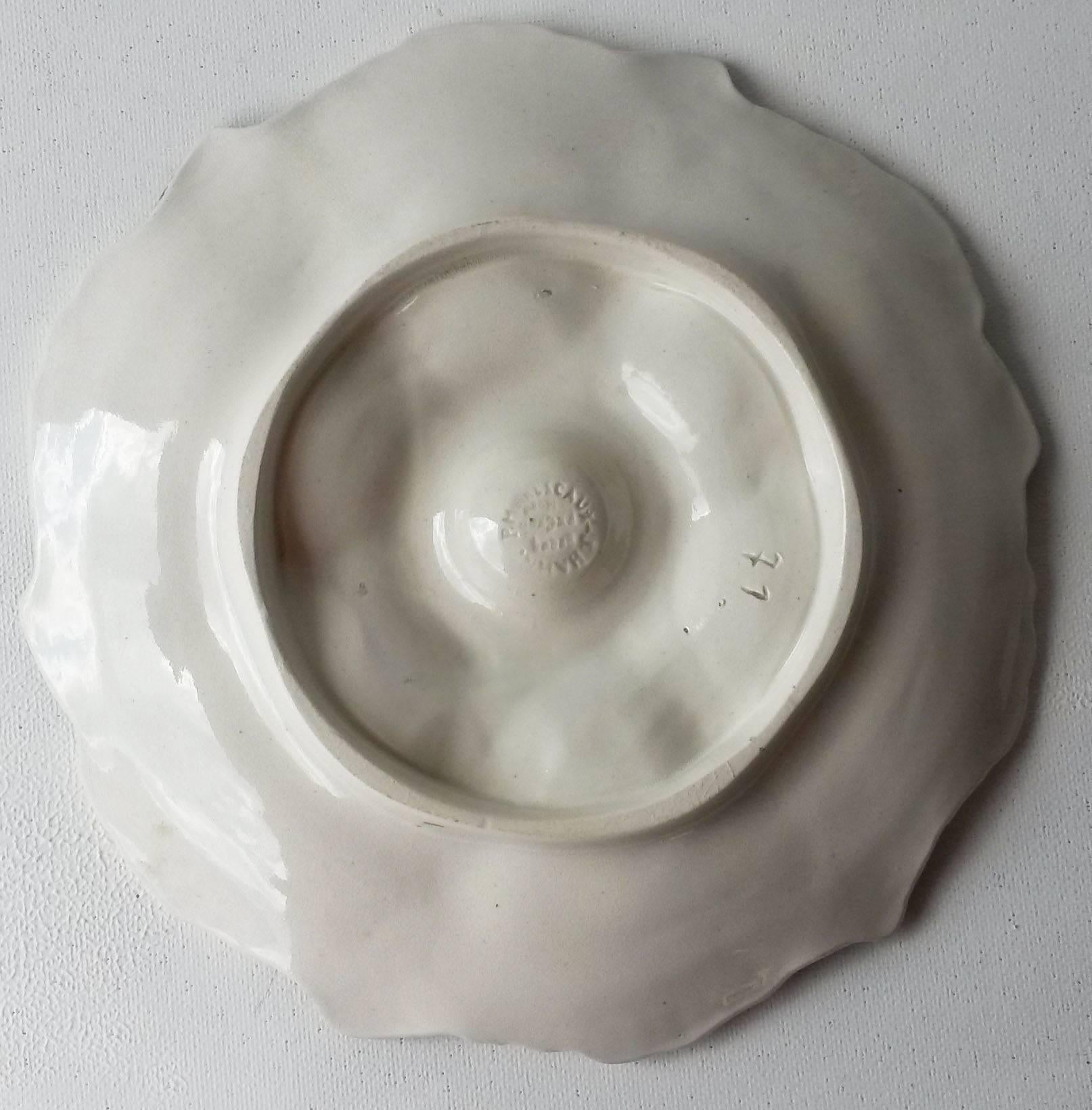 19th Majolica oyster plate signed J. Hahn Marescaux.
Between each pink white iridescent shells, grey oysters in relief.