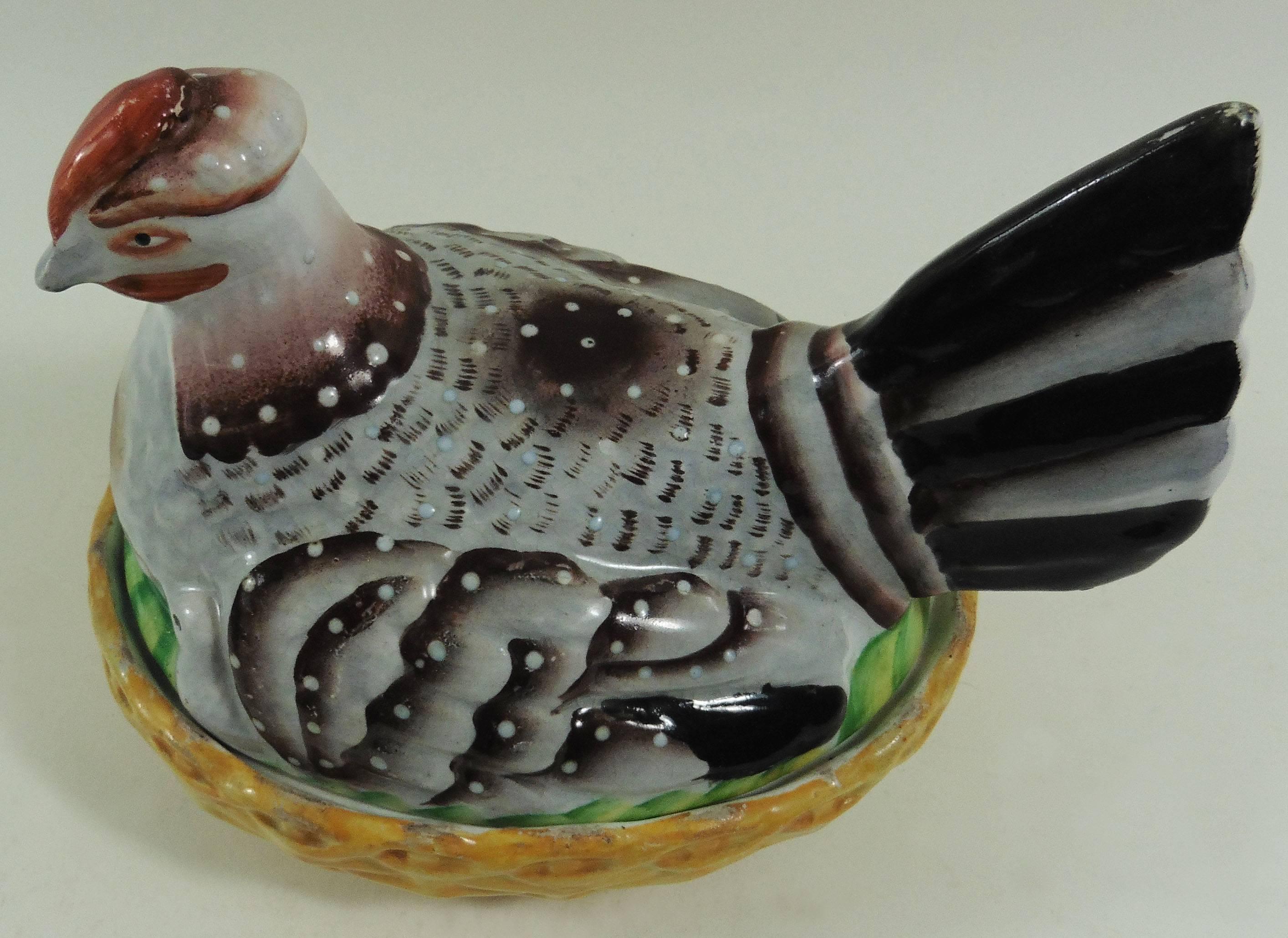 Colorful 19th century Staffordshire hen on nest tureen with orange basket.