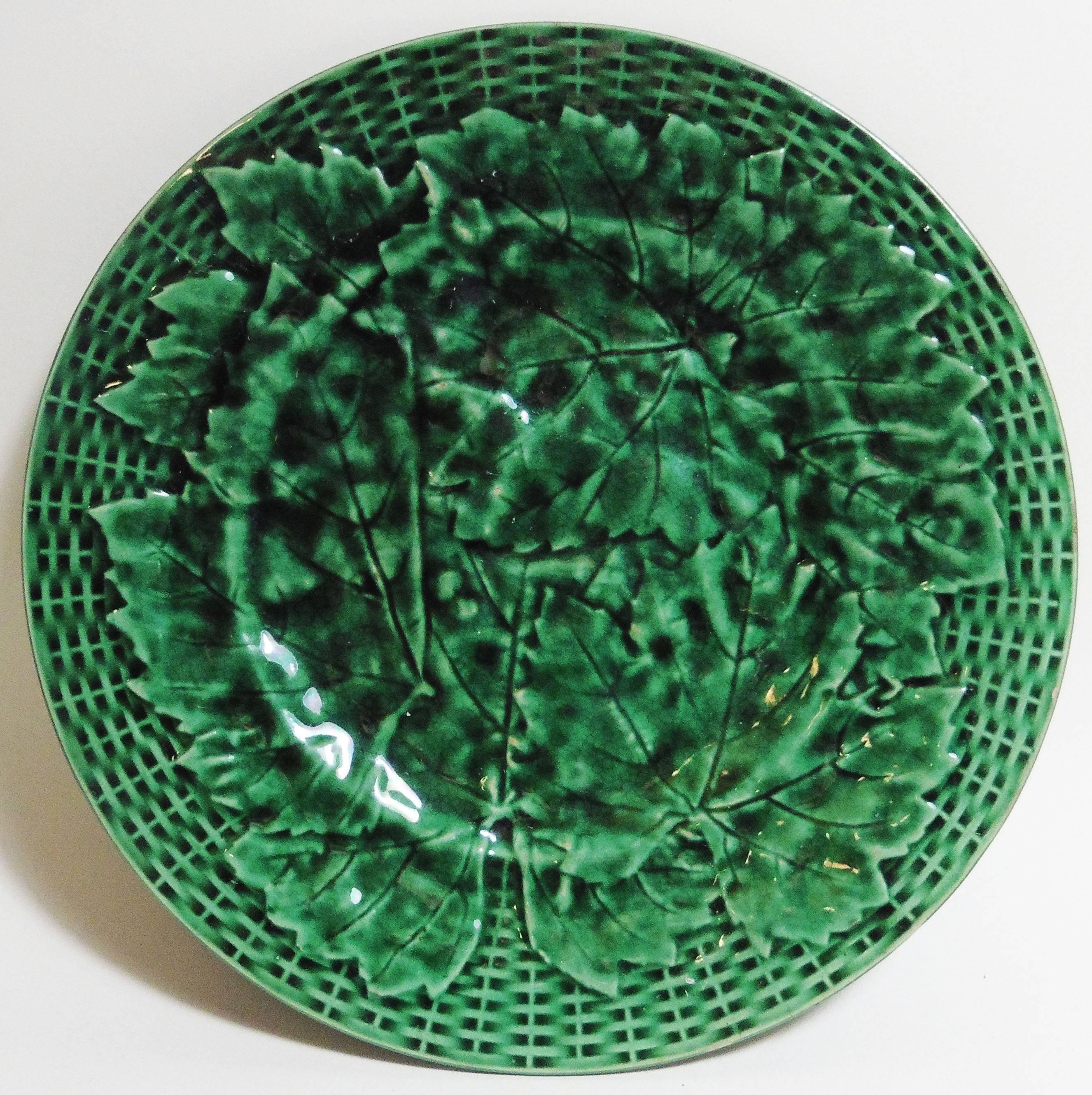 Pair of English Majolica green plates with leaves on a basket weave background, circa 1880.