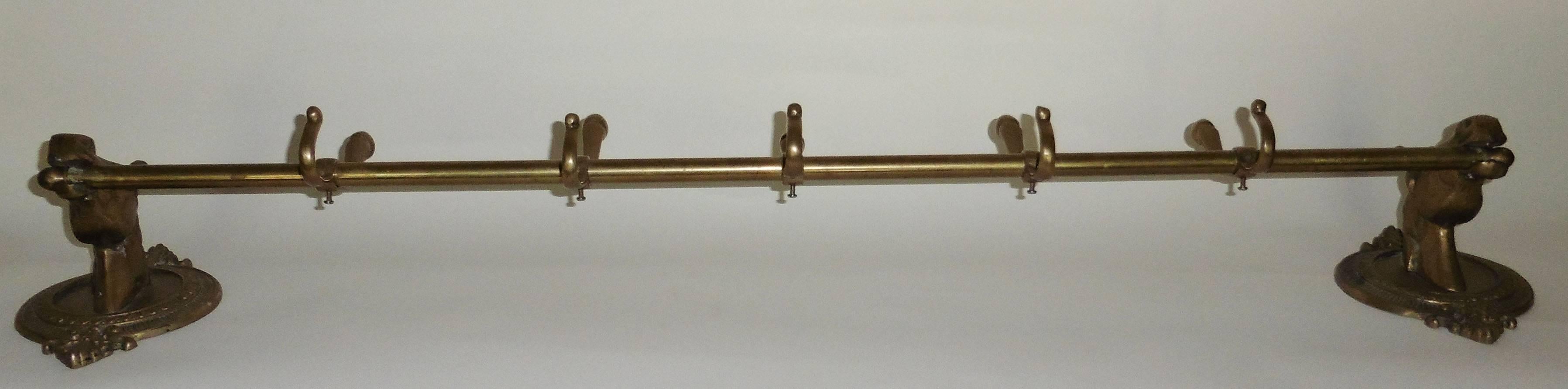 Stunning French oversize brass coat rack with heads horses on a medallion.
Measures: 42