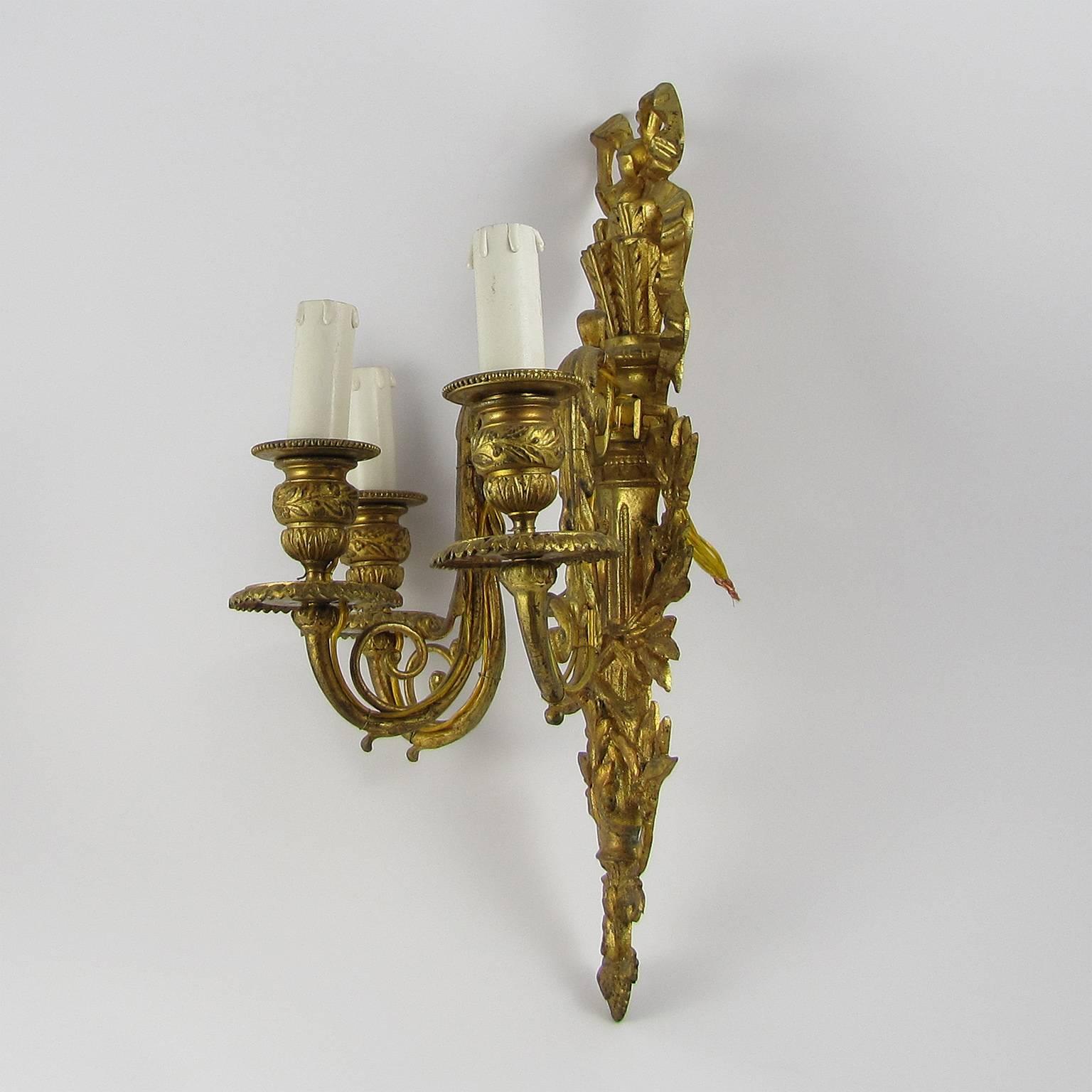 A beautiful pair of neoclassical gilt bronze three-arm sconces,
Italy, end of the 18th century.
 