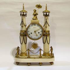 Two Late-18th Century Louis XVI Ormolu-Mounted and Carrara Marble Mantel Clocks