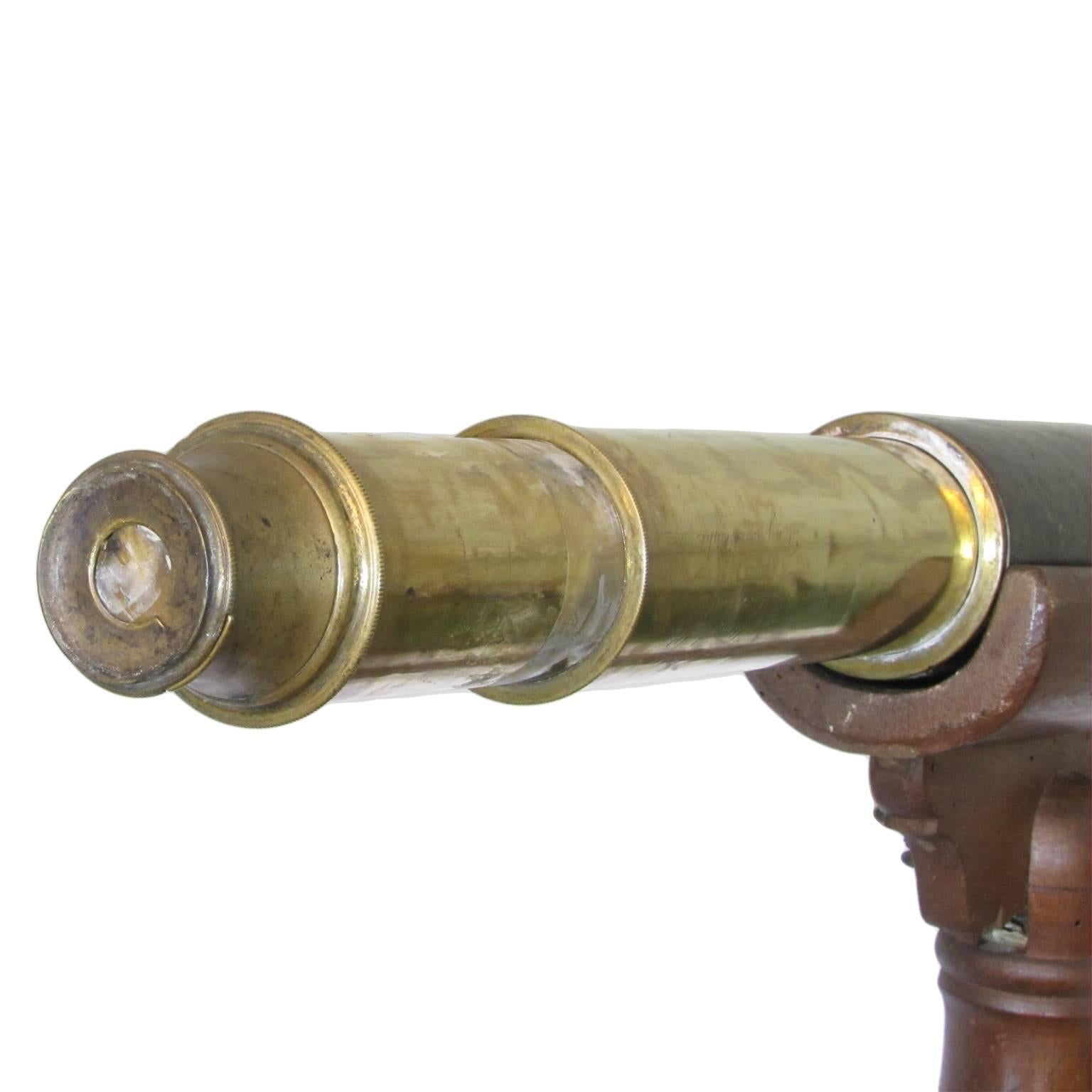 A large 19th century astronomical telescope on its original wooden tripod, in solid walnut. This beautiful piece features a brass and leather body and was manufactured and signed by Thomas Roberts, Liverpool, England. 
Inscription: 'Thomas Roberts,