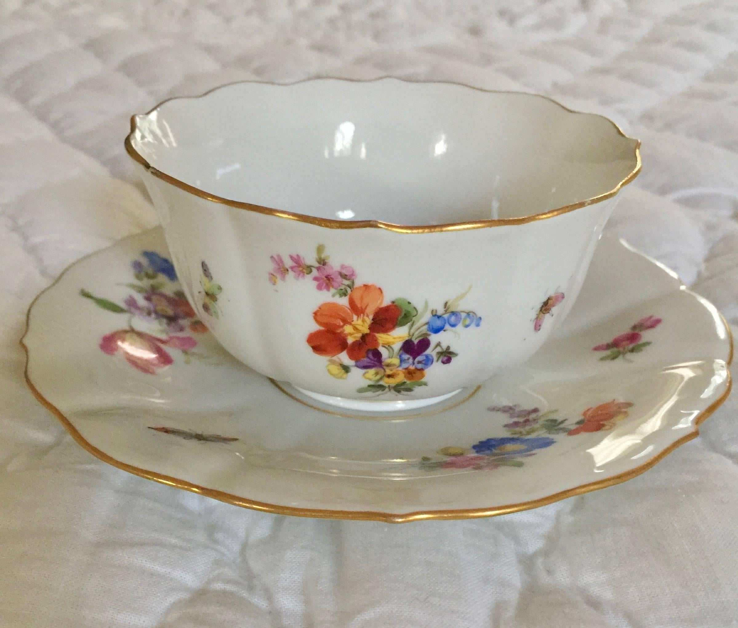 19th century Meissen porcelain painted gilt cup and saucer
Painted with flowers butterfly and insect
Cup measures 4