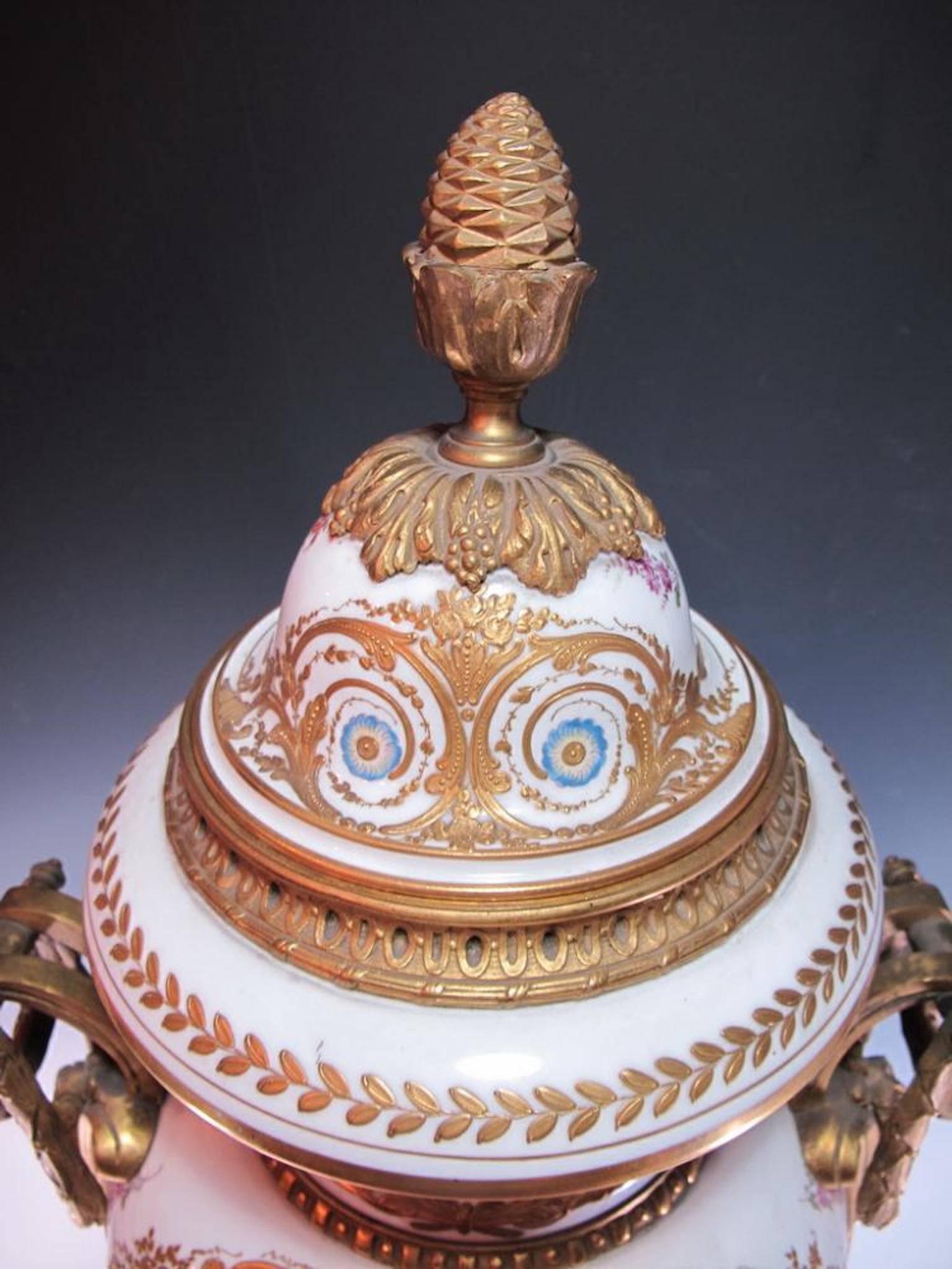 19th century French Sevres bronze and porcelain urn. Measures: 32 5/8" H x 12 3/4" W. Signed.

Sèvres porcelain, French hard-paste, or true, porcelain as well as soft-paste porcelain (a porcellaneous material rather than true porcelain)
