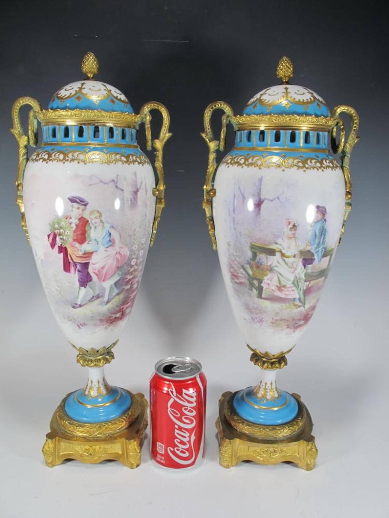 Antique French sevres pair of bronze and porcelain urns. Measures: 18 1/2 H.

Sèvres porcelain, French hard-paste, or true, porcelain as well as soft-paste porcelain (a porcellaneous material rather than true porcelain) made at the royal factory