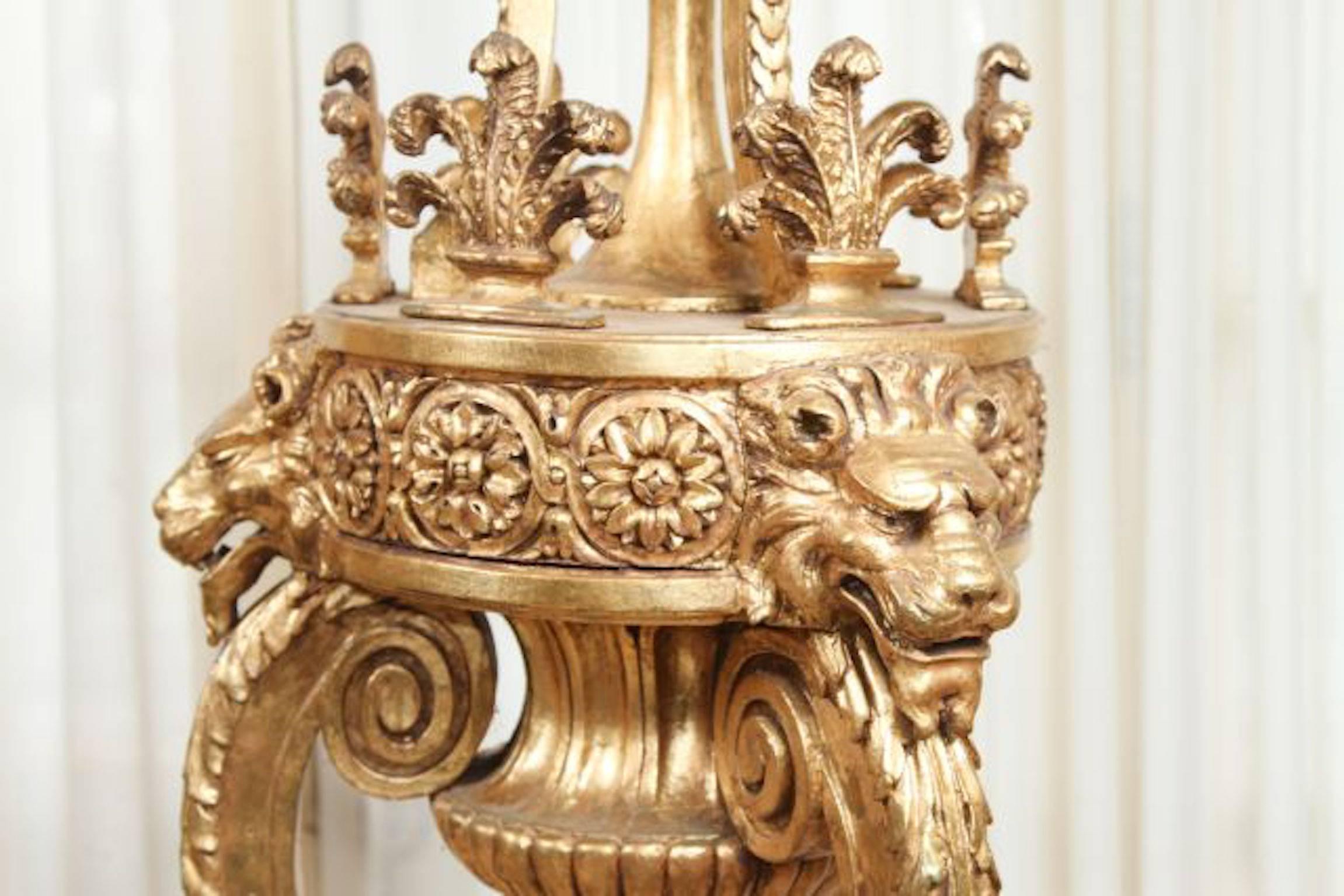 Pair of late 19th century Louis XVI style torchieres with lions head and vase form urn ornamentation on sienna marble bases. Measures: 65