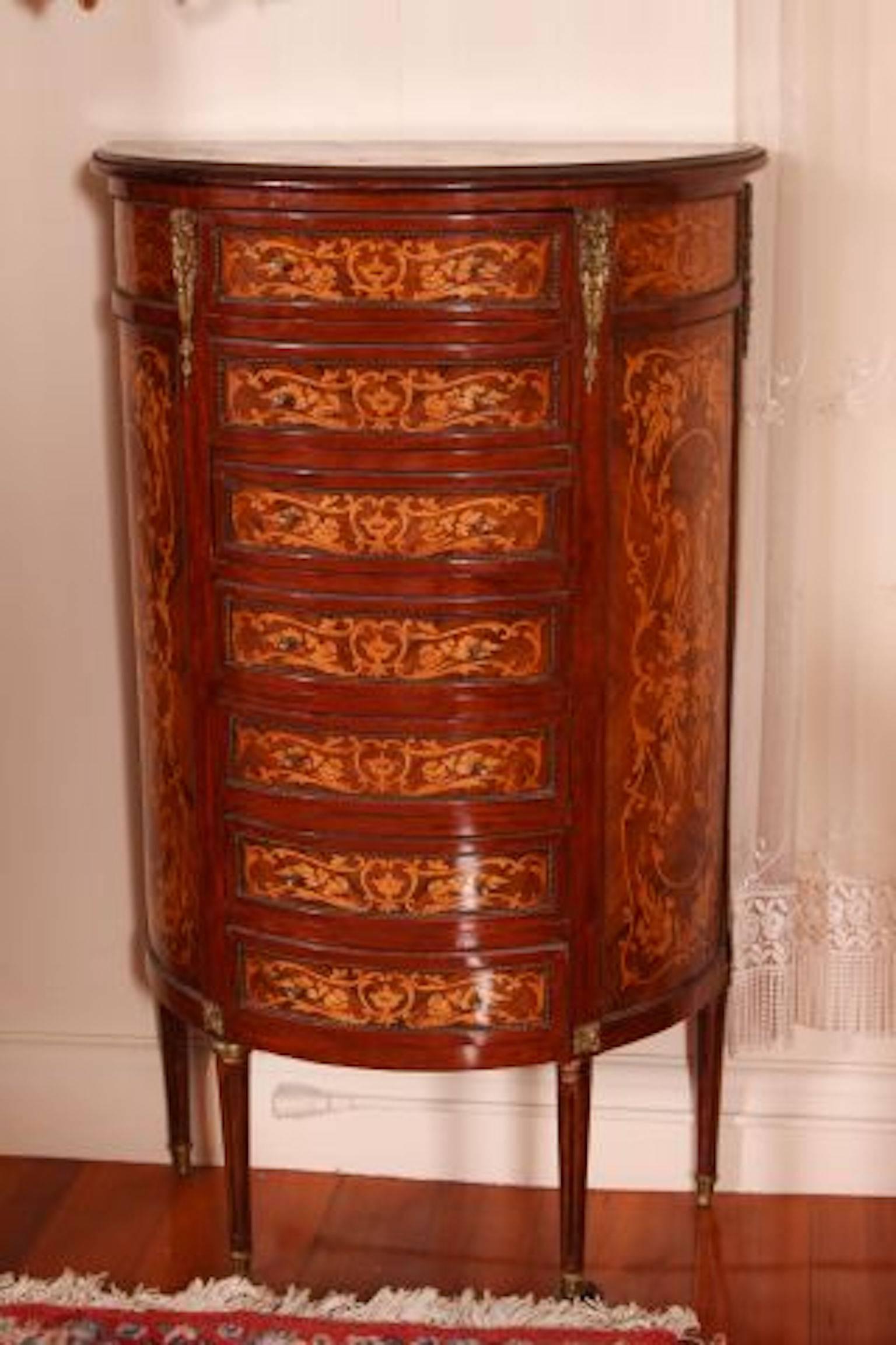19th century French seven-drawer marquetry chest with ormolu decoration. Measures: 48
