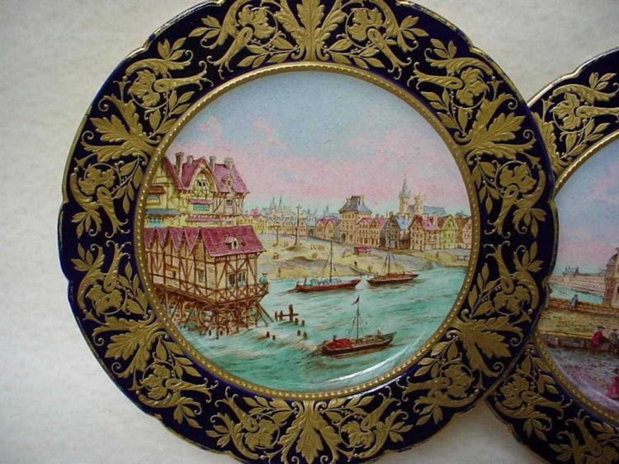 Two beautiful 18th century Sevres hand-painted plates depicting a scene from a city possibly Venice. Stamped with the Sevres mark on the back, signed by the artist Danielle, and signed "La Samaritaine" above the Sevres mark on the back.