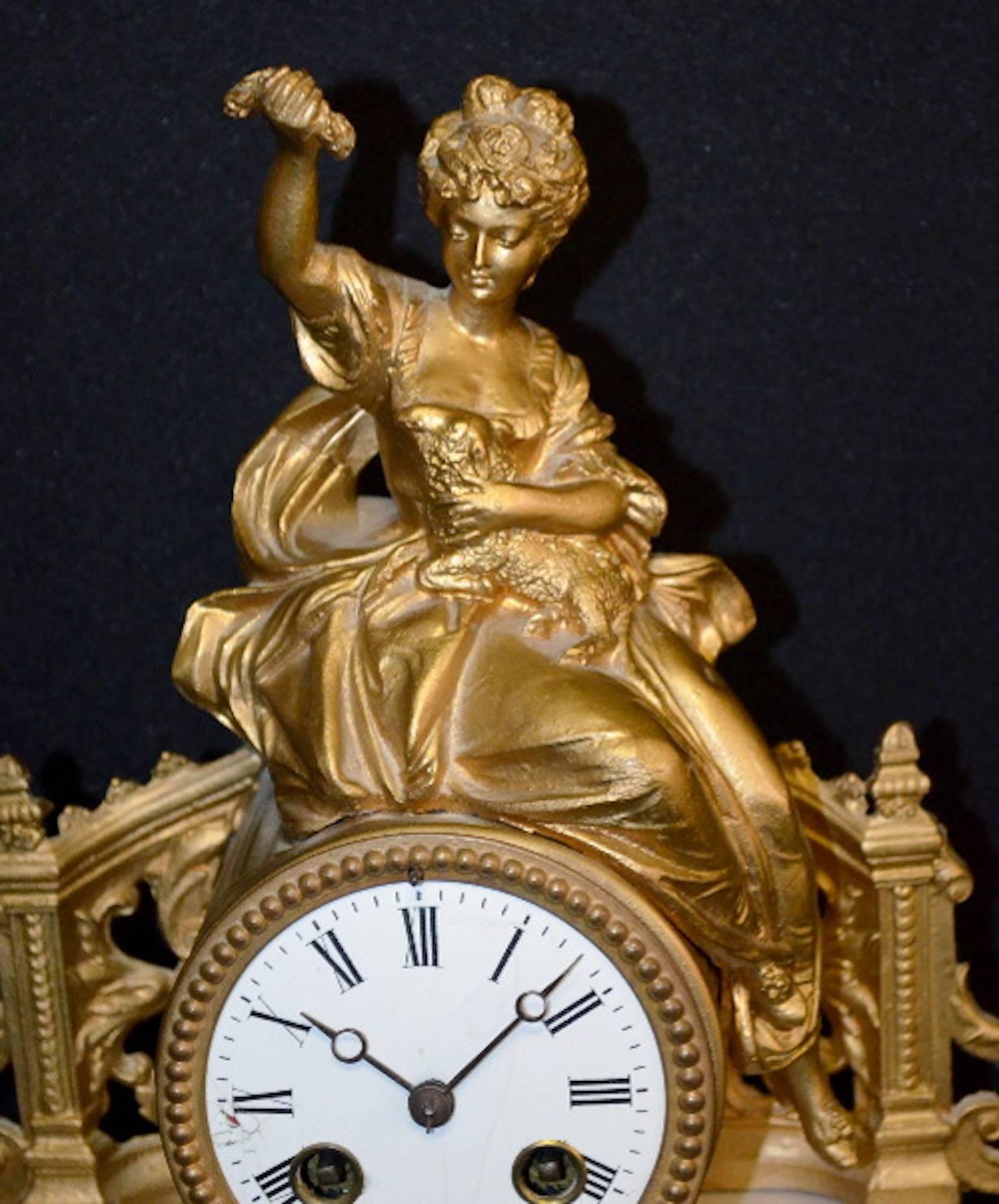 Antique French Japy Freres Alabaster statue clock: T & S with a porcelain dial. The movement is marked "Japy Freres" "G.R." in an oval and numbered 3062. The clock has the pendulum and key with it. The metal statue is of a