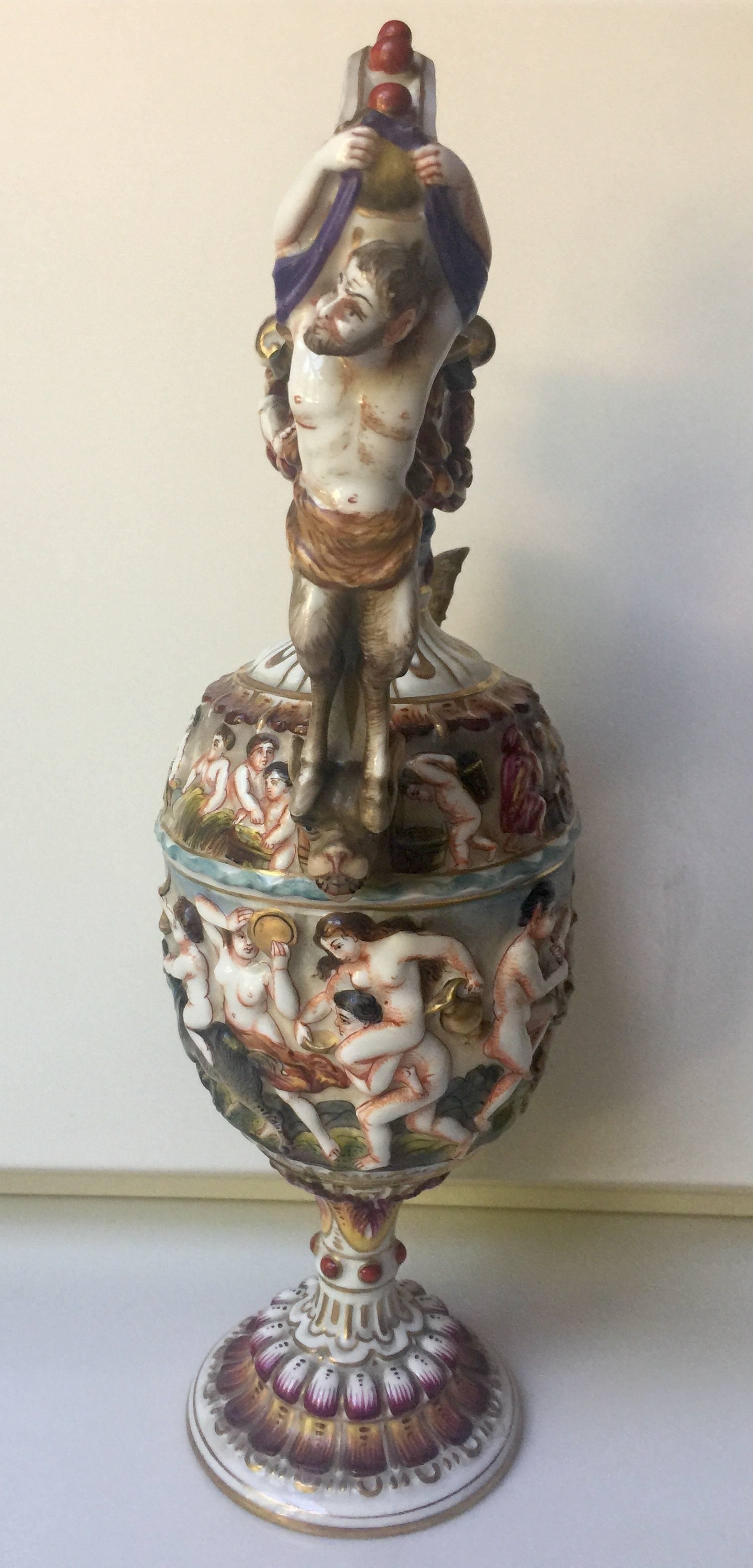 Capodimonte Ewer example with reliefs of putti frolicking with animals.
 