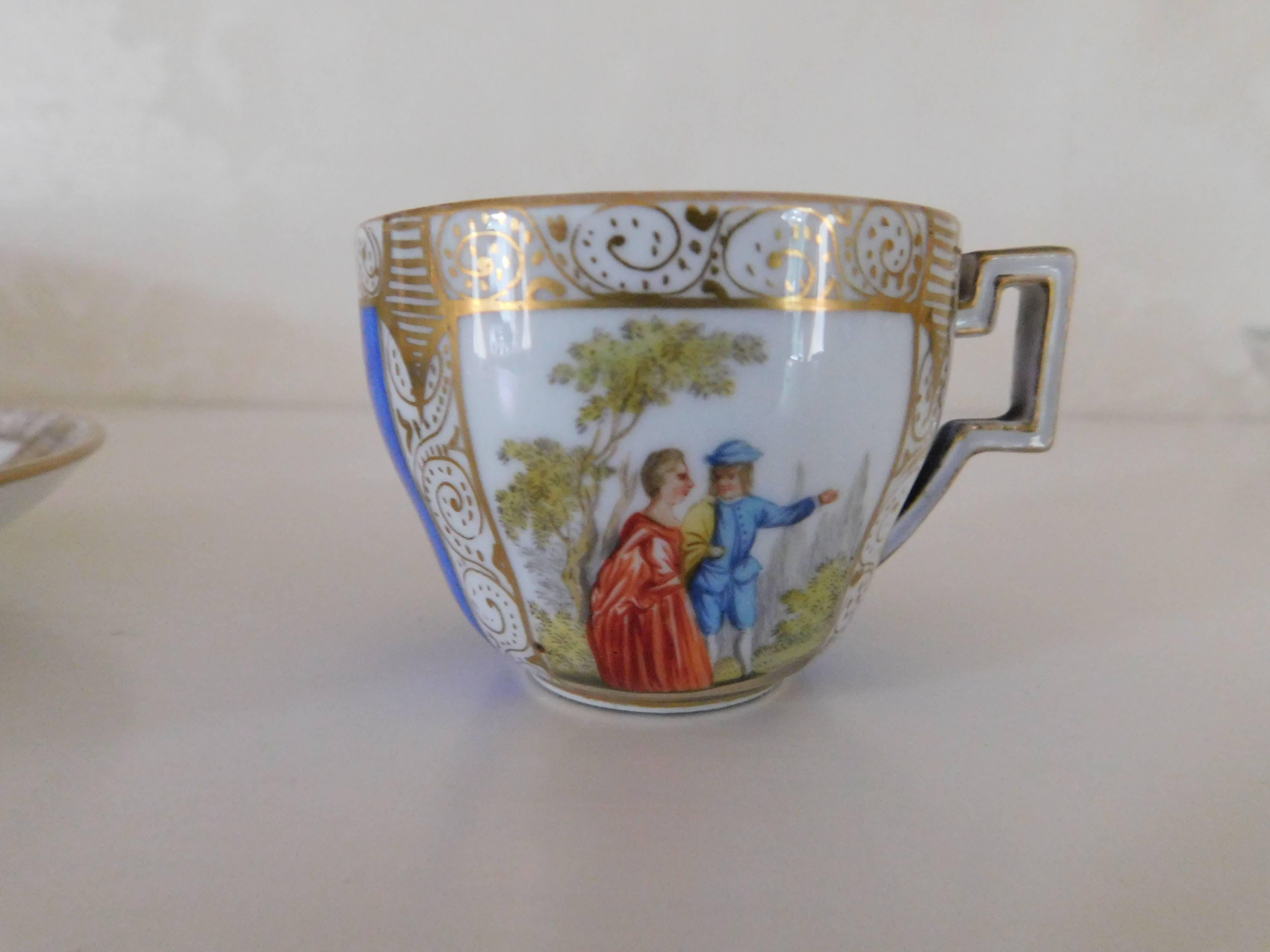 19th century Meissen porcelain cup and saucer 
Hand-painted with scene of man & woman. Blue with gold trim.
Measures: Cup 2.13 In. D x 1.75 In. H
Saucer 4.25 In. D x .75 In. H

Meissen porcelain or Meissen china is the first European hard-paste