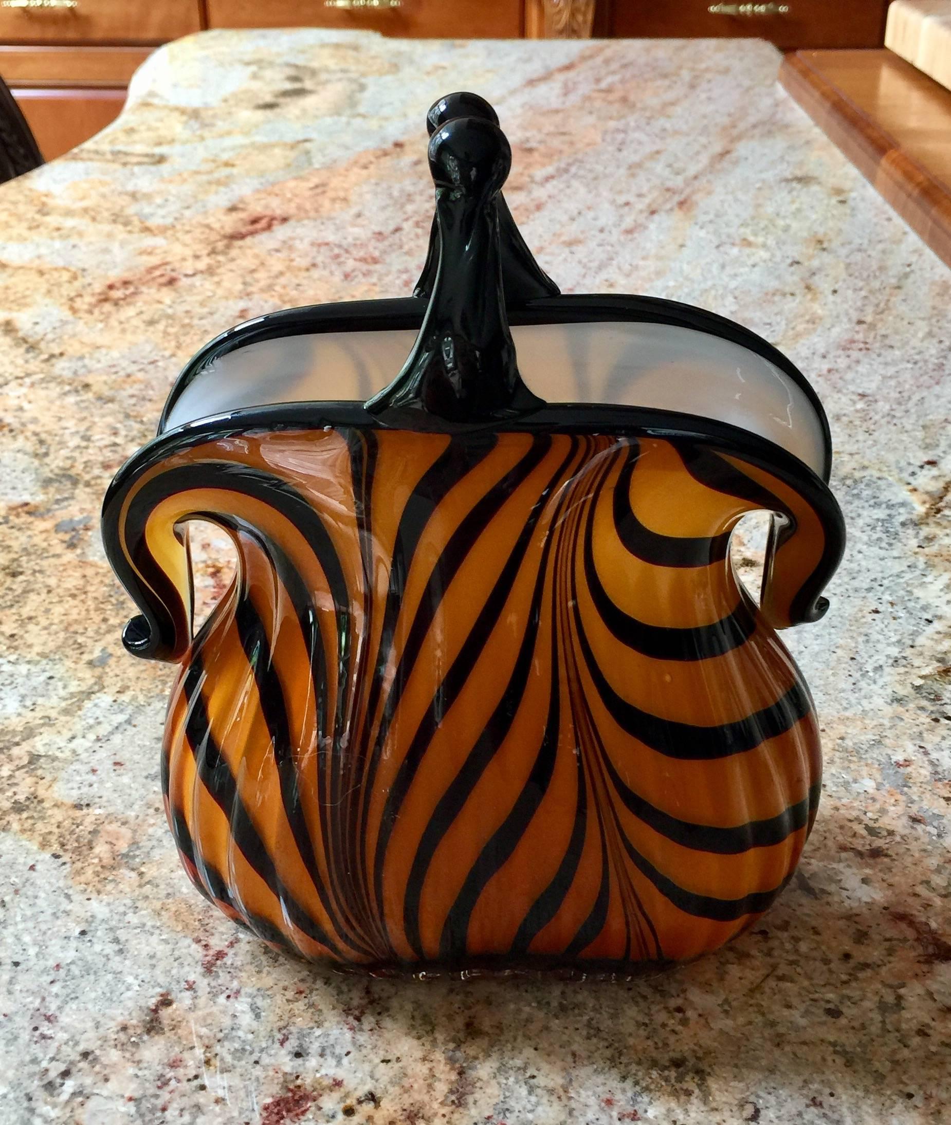 Art Deco signed Murano amber glass purse
excellent condition.