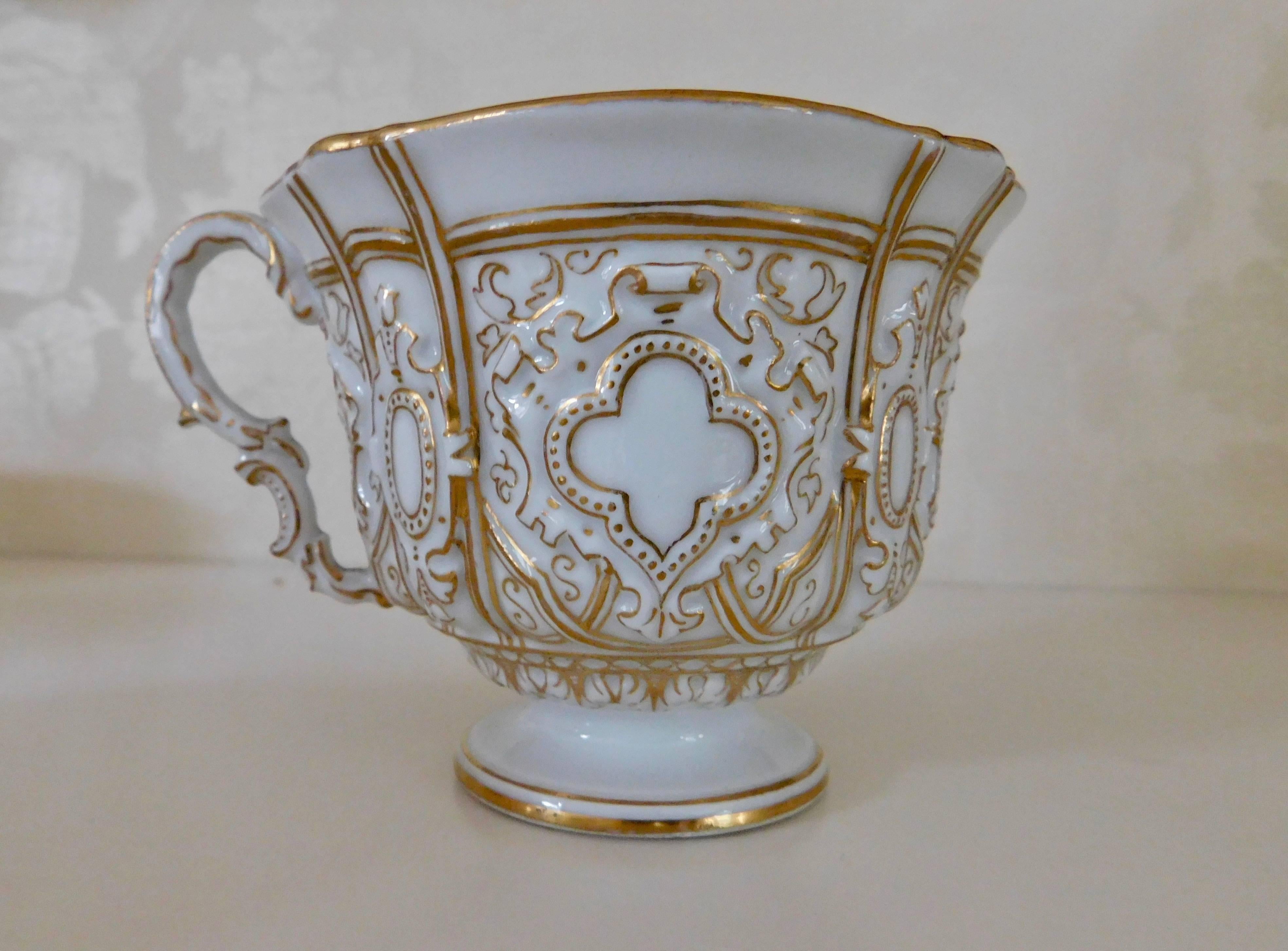Early 20th century Meissen porcelain heavy gold trim embossed cup and saucer.
White porcelain cup and saucer beautifully detailed in gold.
Measurements in inches:
cup 4 D x 3.13 H
saucer 6 D x 1 H.
   