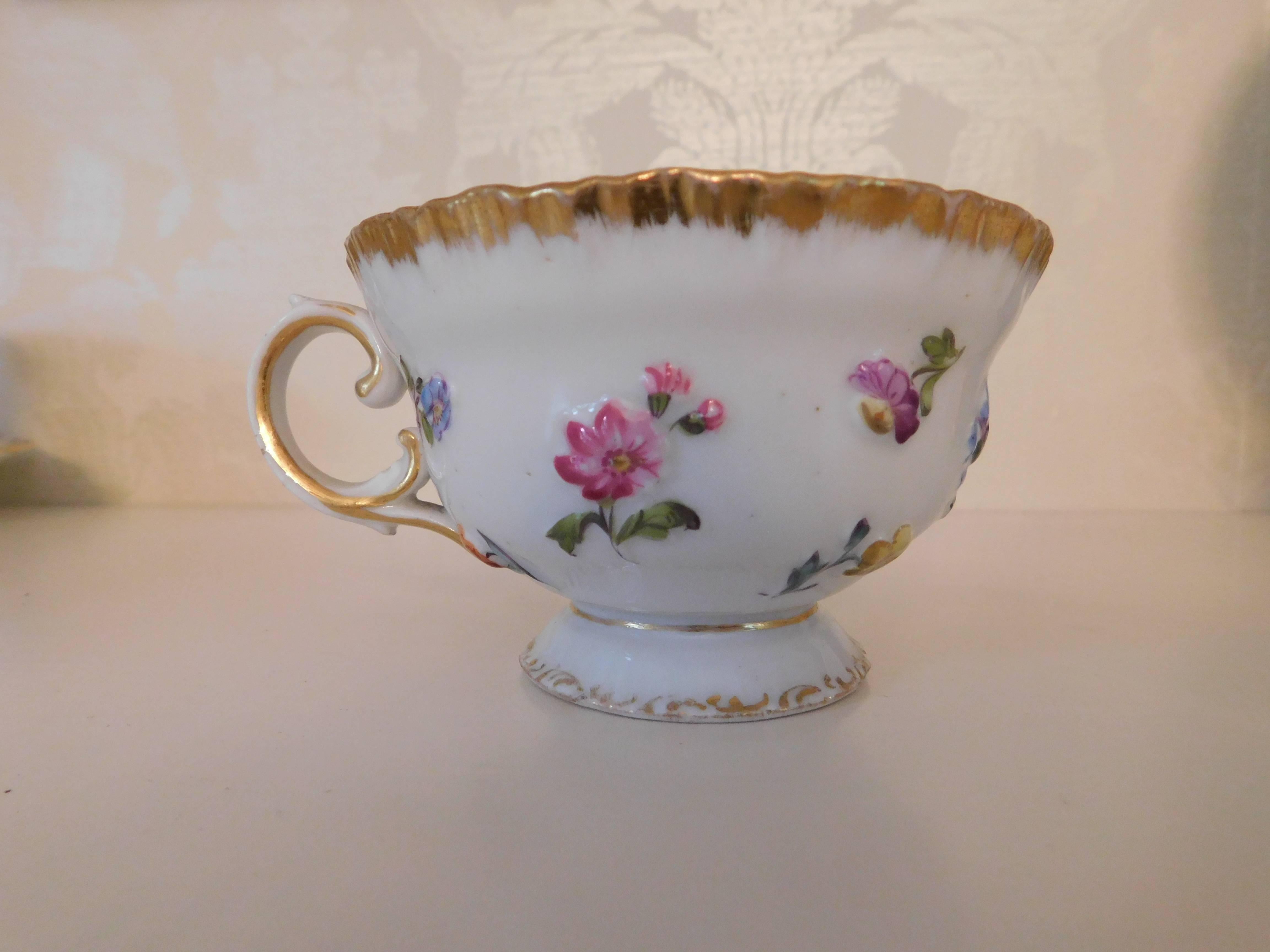 19th century Meissen porcelain cup and saucer painted with flowers and gold

Measurements in inches:
Cup 3.63 D x 2.25 H
Saucer 6 D x 1.25 H.