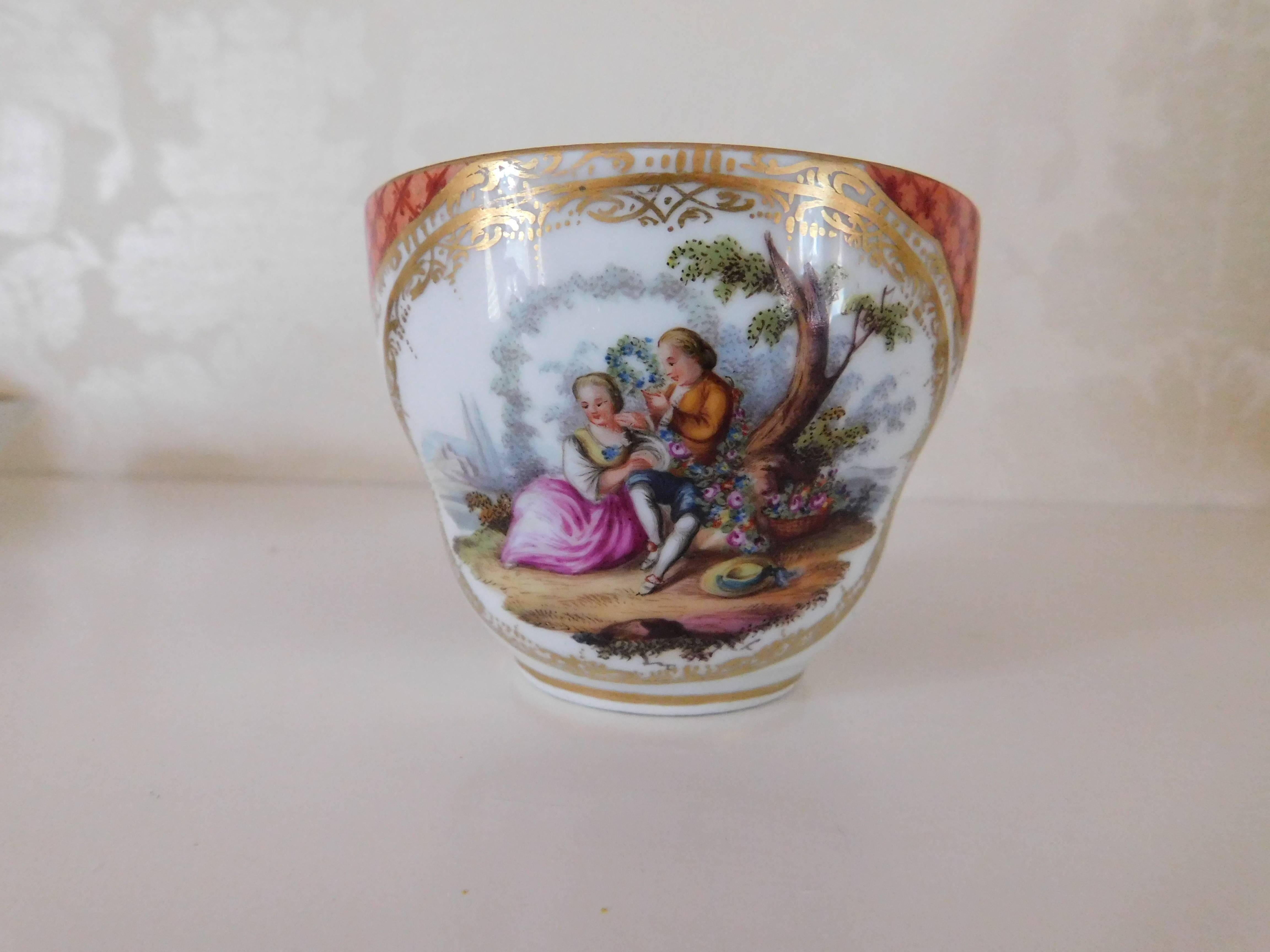 19th century, Meissen Porcelain cup and saucer with gallant scene 
Measurements in inches:
Cup 3 D x 2.5 H
Saucer 5.75 D x 1.5 H.