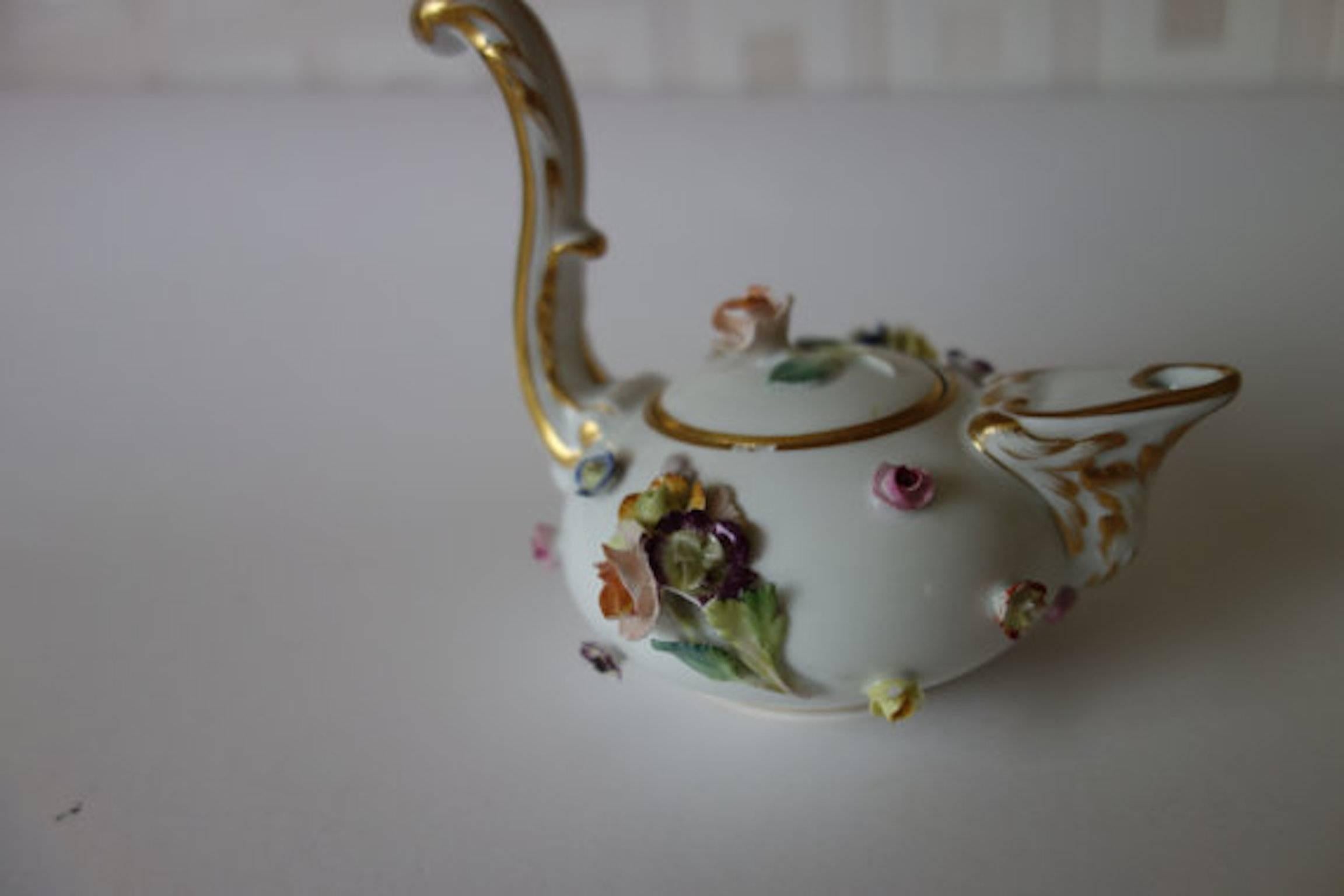 Meissen teapot with high handle and encrusted flowers
Crossed swords 