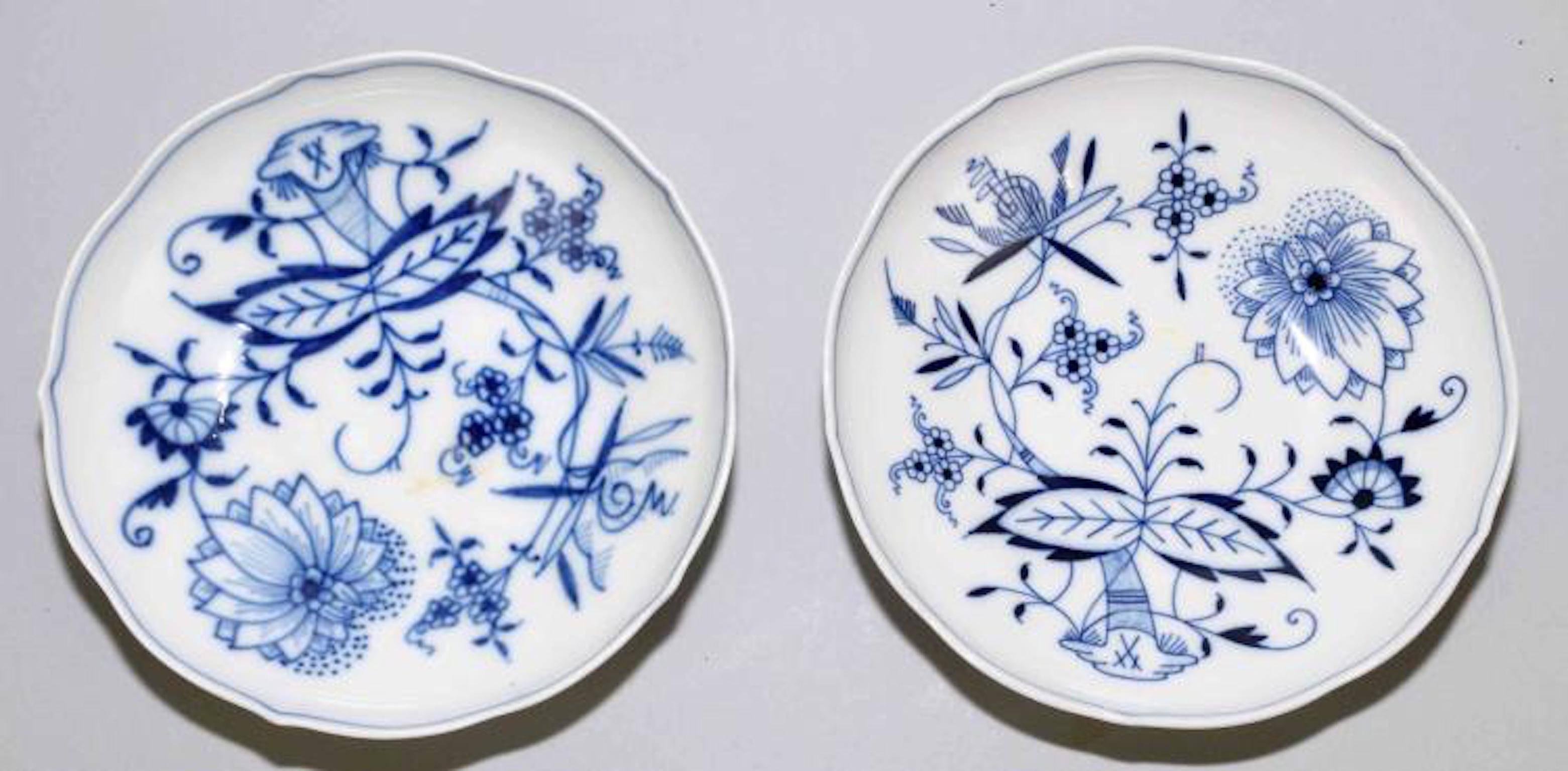 Meissen porcelain blue onion cups and saucers, set of two
Cup measures in inches: 4.5 W x 3.5 D x 2.5 H
Saucer measures in inches: 6 D x 1 H.