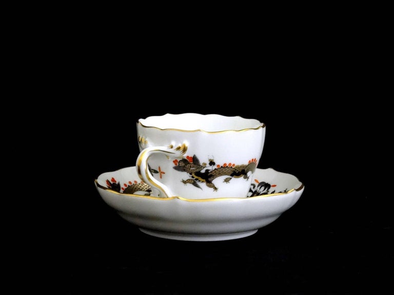 Meissen black dragon red accent demitasse cup and saucer with red accents
Fabulous antique cup and saucer from Germany. This one is in the black Dragon with Red Accents design. It is just stunning. Both pieces are in excellent condition. Since they