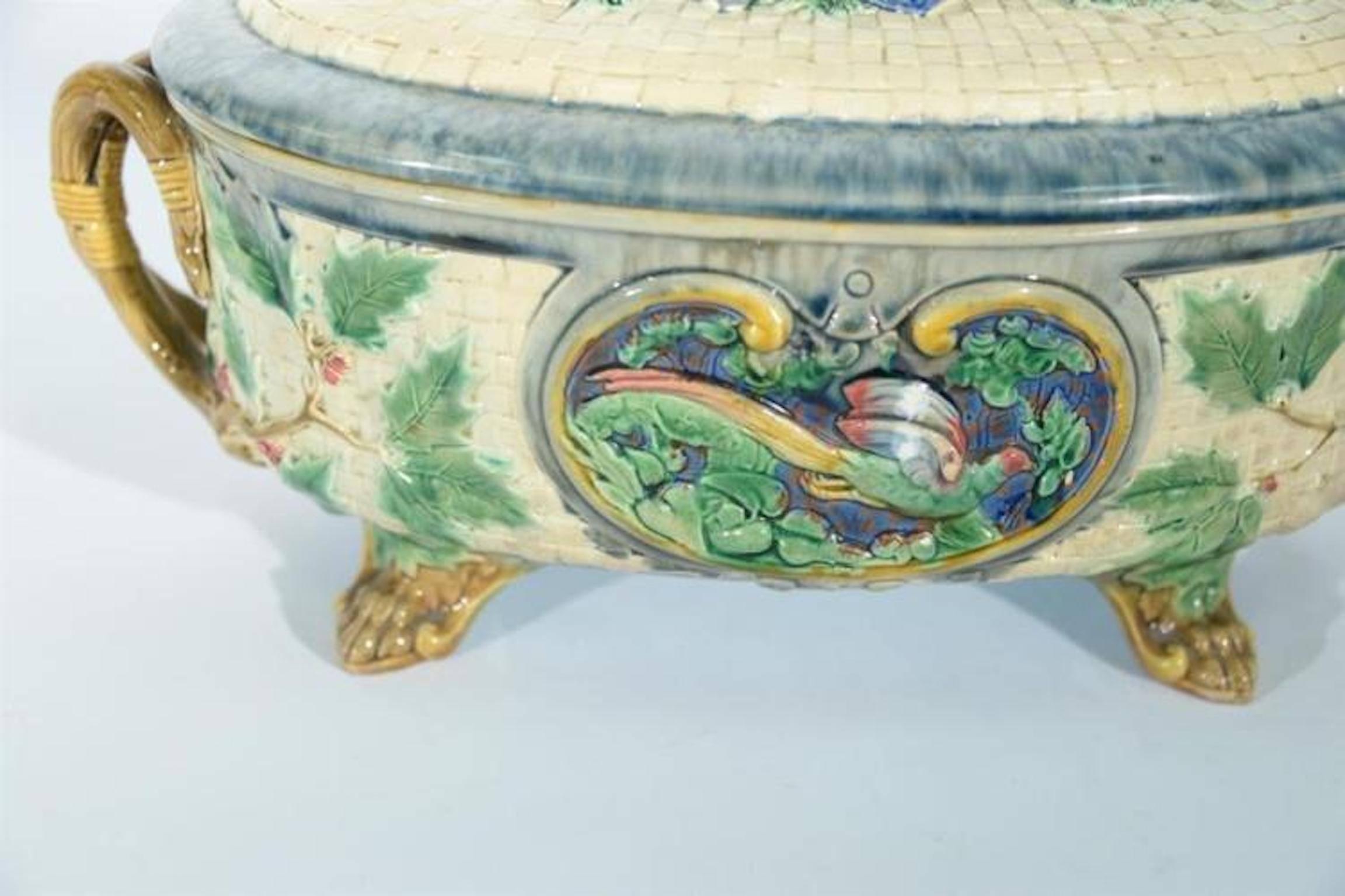 Minton Majolica covered tureen having basket weave body and cover. With hunting dog finial, rabbit and pheasant panel on each side, circa 1875. Sothebys sold $8750 March 11 1997