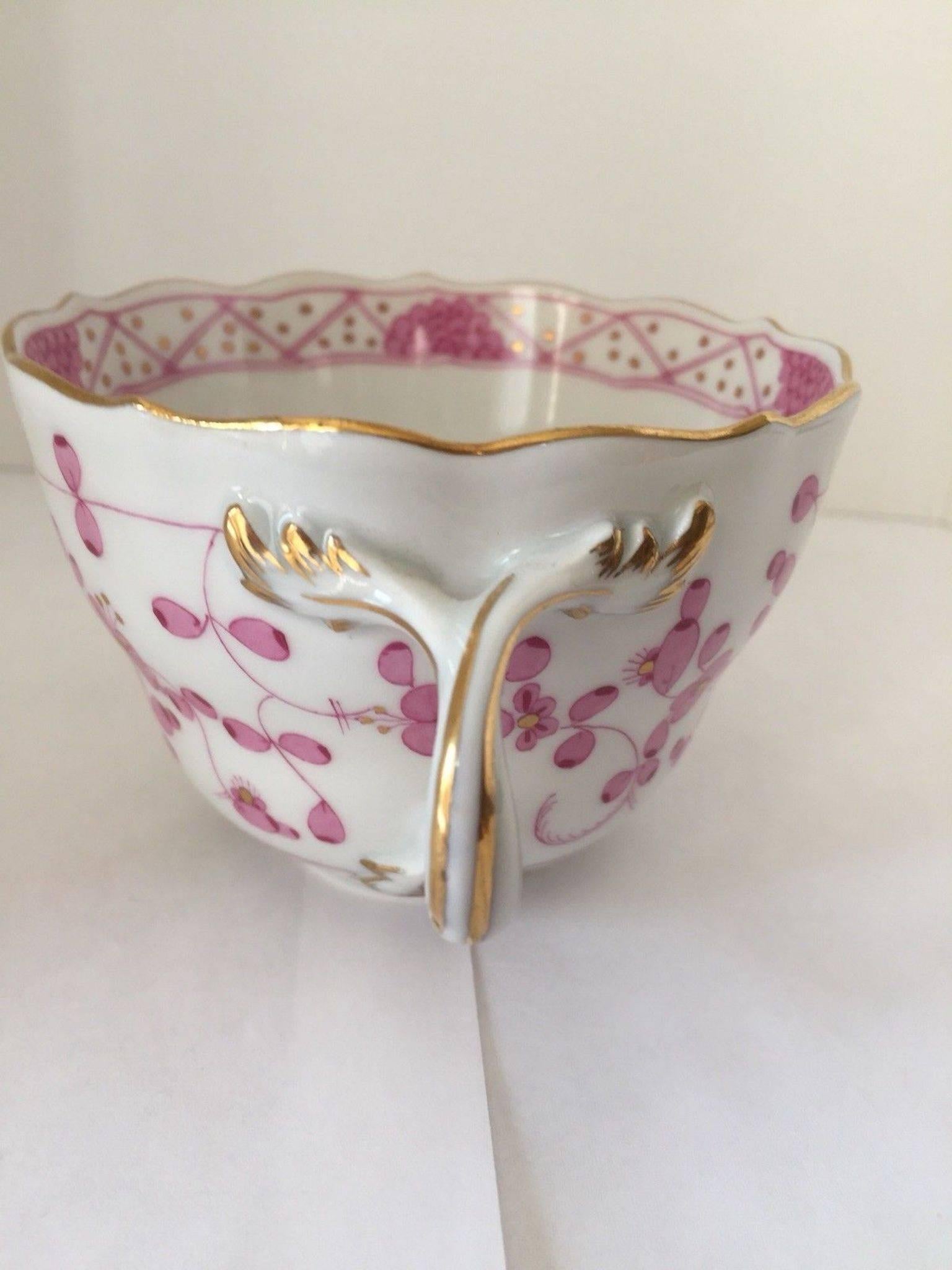 This is a beautiful Meissen scalloped cup and saucer in the purple Indian pattern. The cup has a twisted leaf handle. There is gilt trim on rim of cup and saucer. This dates circa 1850-1900, they are both marked with crossed sword mark on bottom.