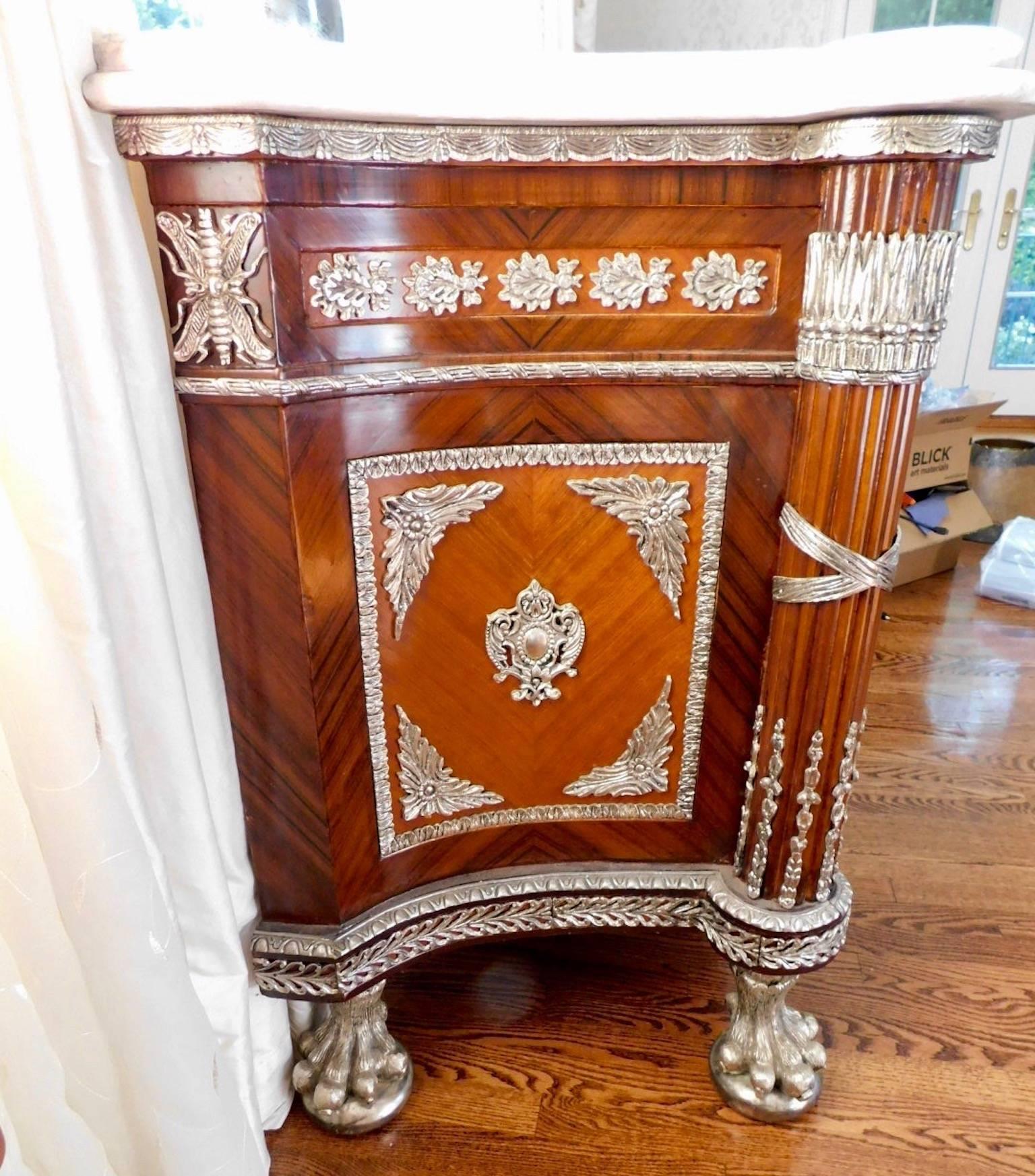 Revolution commode silver plated with marble top.