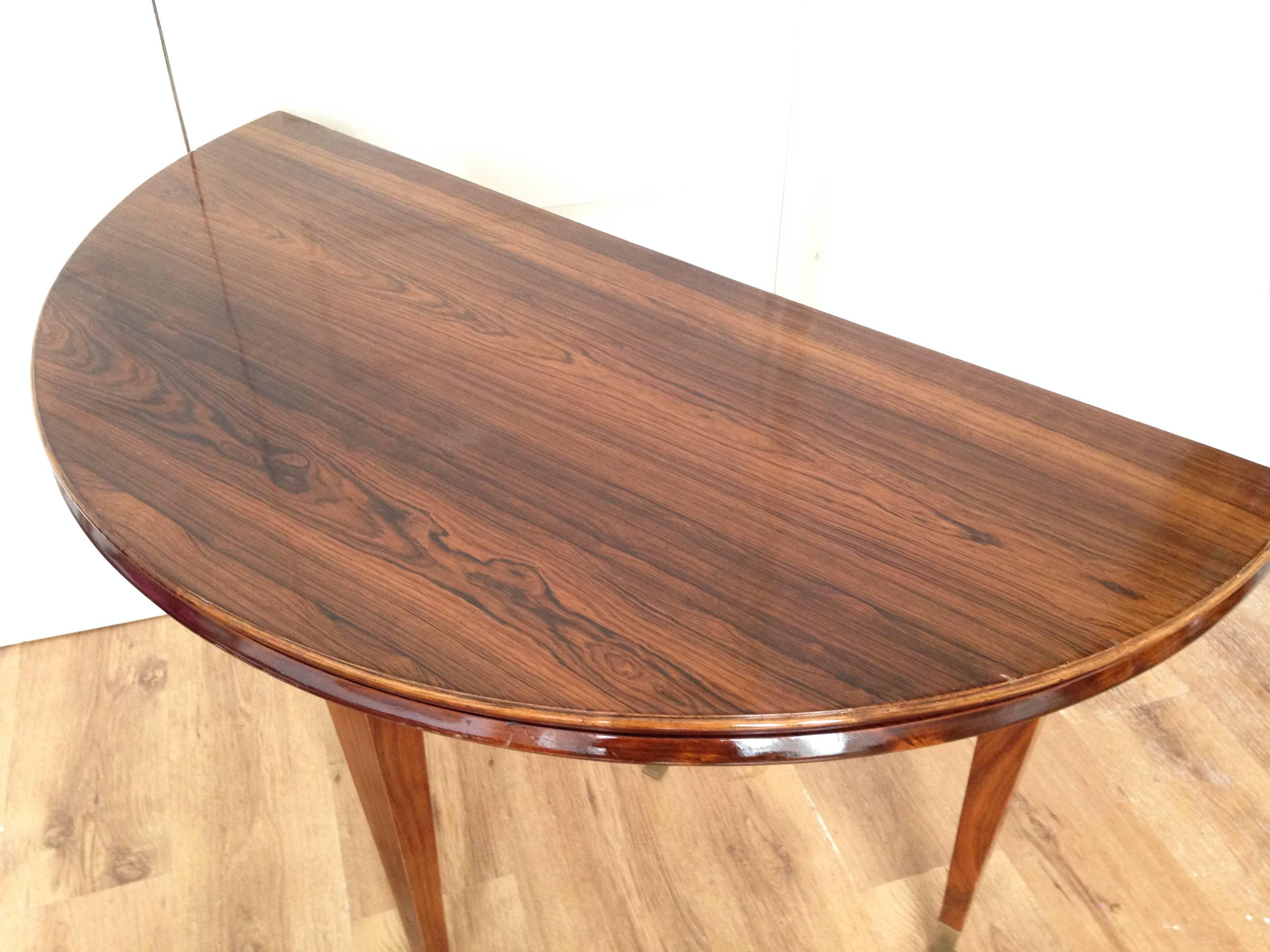 Italian rosewood fold over side table. Superb figured grain on slender tapered legs with ormolu mounts. The legs unscrew for safe shipping.