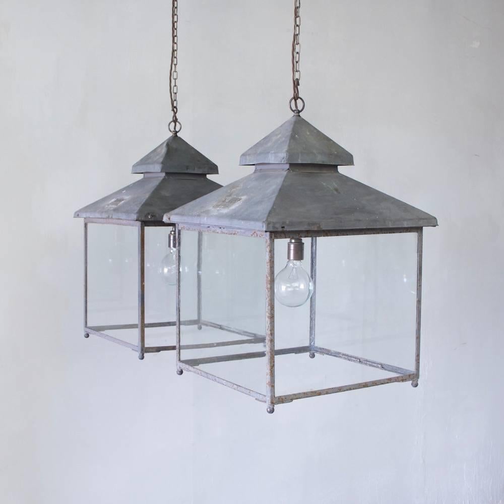 An original pair of 1930s English copper and iron lanterns.
