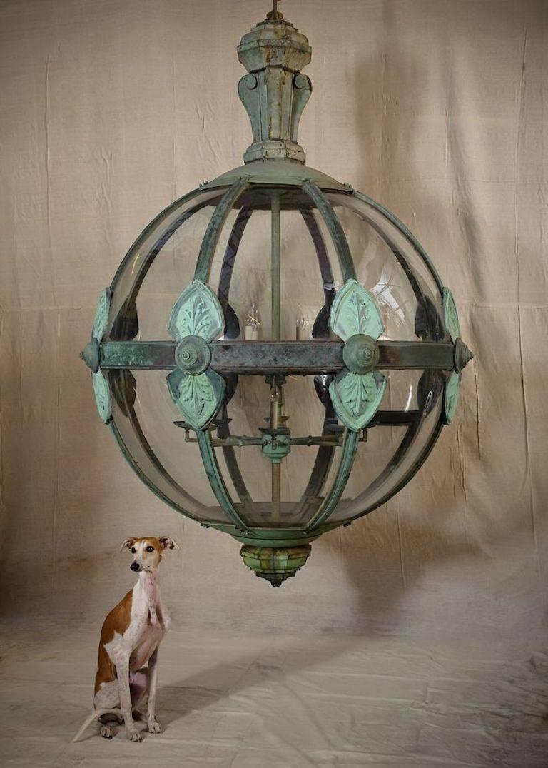 A large and wonderful sixteen-light classical globe lantern constructed from 19th century components. Copper and curved glass with leaf detail. Wired and working.