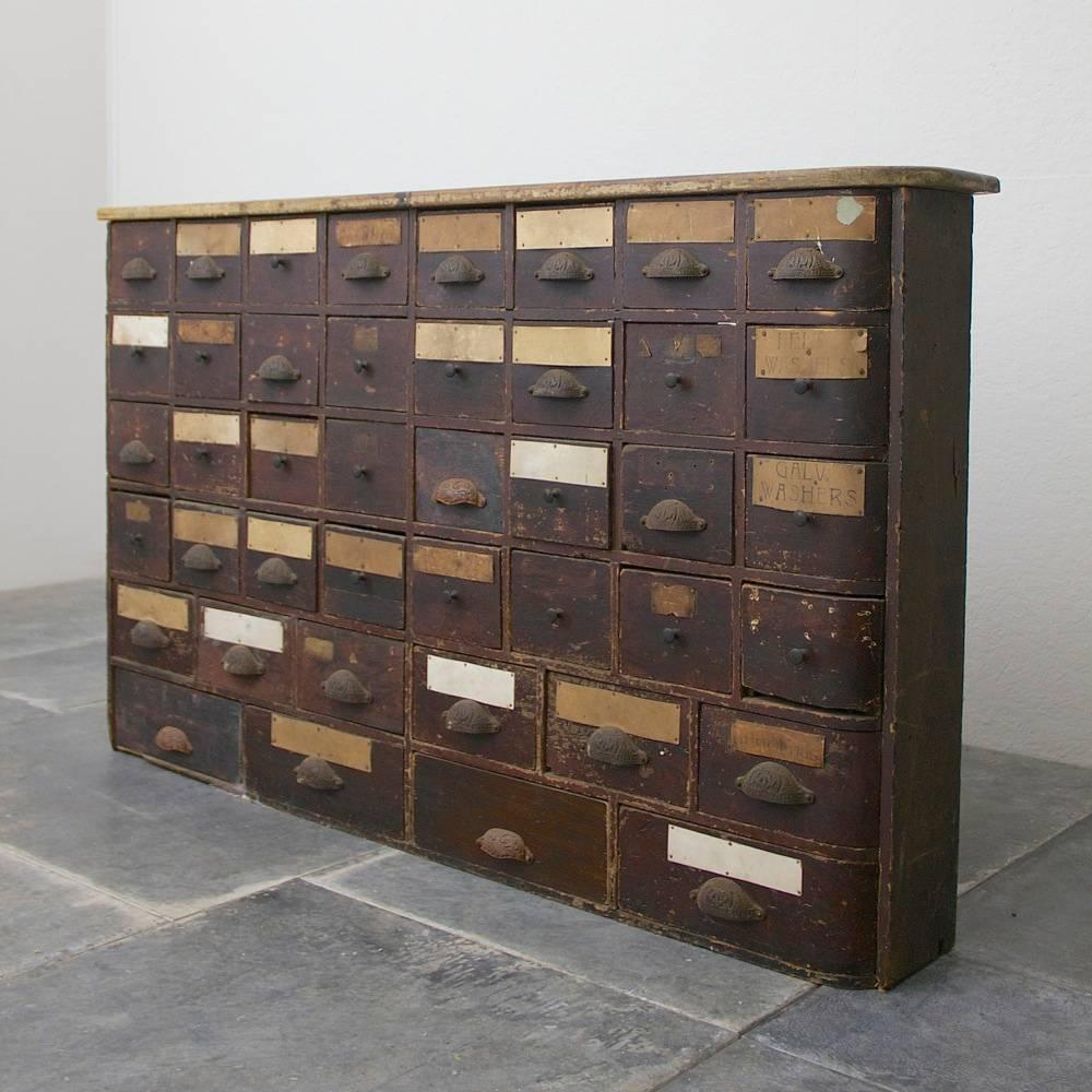 An interesting 19th century bank of drawers with a curved end, English, circa 1880.