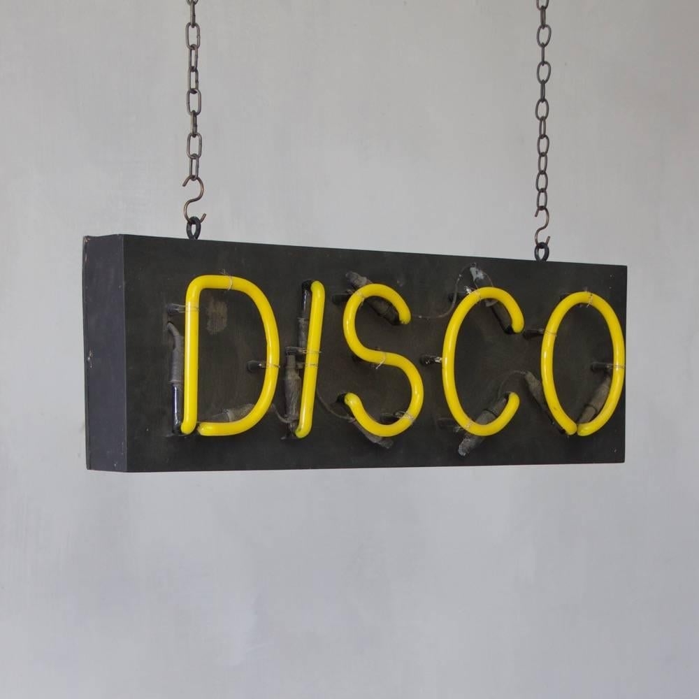 A 1980s neon disco sign in full working order England, circa 1980.