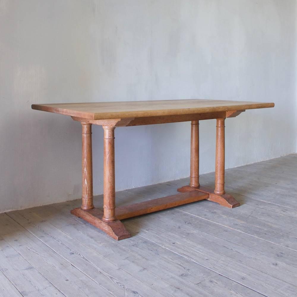 An oak dining table designed by the architect Philip Tilden in collaboration with Ambrose Heal for Winston Churchill's Chartwell residence, circa 1922 and made by Heal & Son. Original maker's label to underside of tabletop.