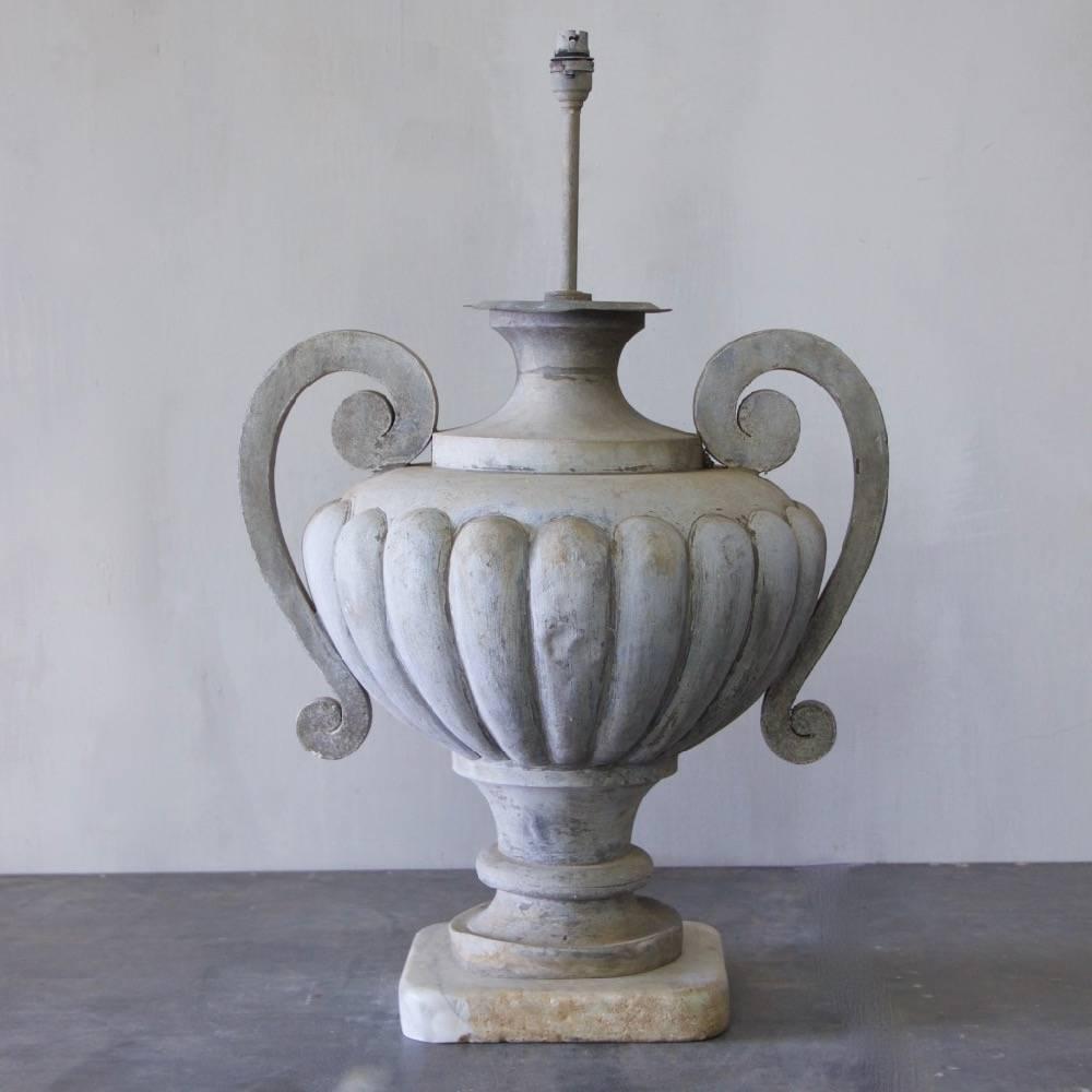 A large 19th century zinc urn, now mounted on a 19th century Carrara marble base and converted into a table lamp, France circa 1880.