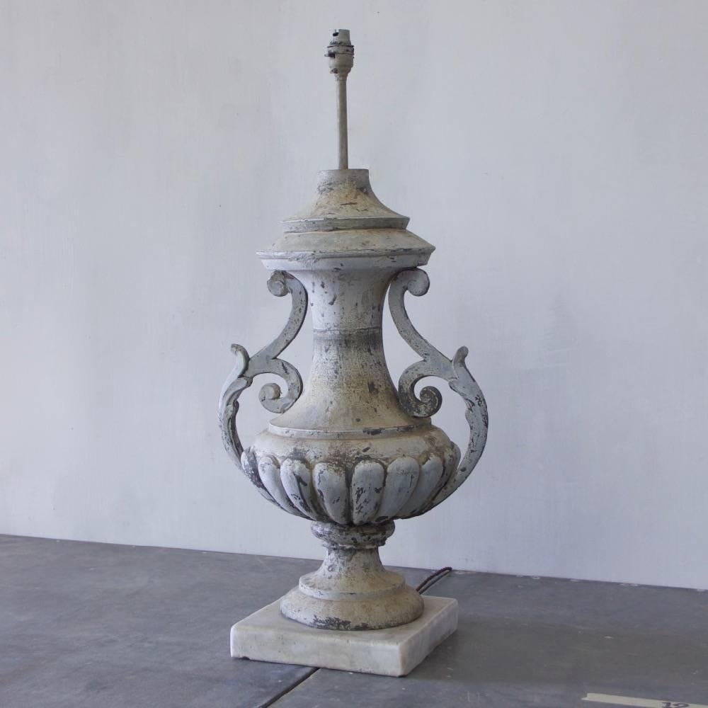A 19th Century zinc urn, mounted on a Carrara marble base and converted into a table lamp. France, circa1880. 