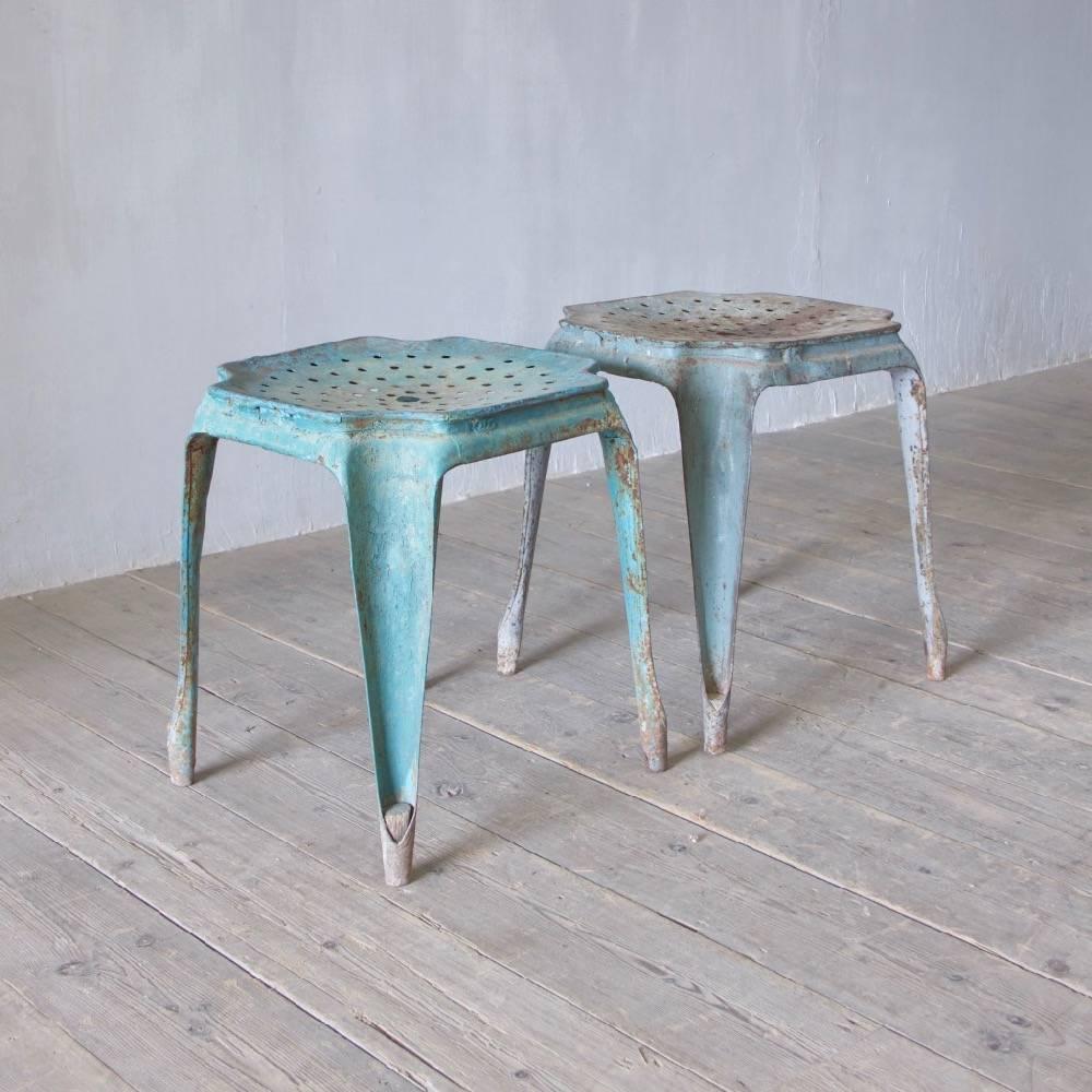 A pair of 1930s Fibrocit folded metal stools, Belgium, circa 1937.