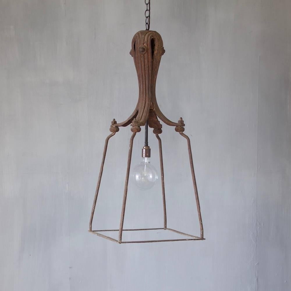 A 19th century cast and wrought iron lantern, England, circa 1850. Wired and ready to hang. Ceiling roses, chain and hooks may be ordered separately.
 