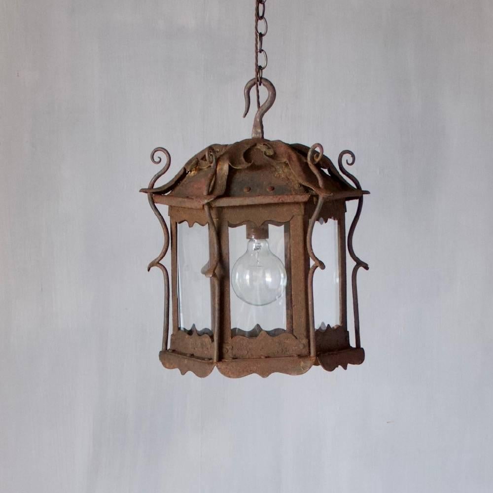 A large original Art Nouveau lantern. Wrought iron. England c.1900. Wired and ready to hang. Ceiling roses, chain and hooks may be ordered separately.